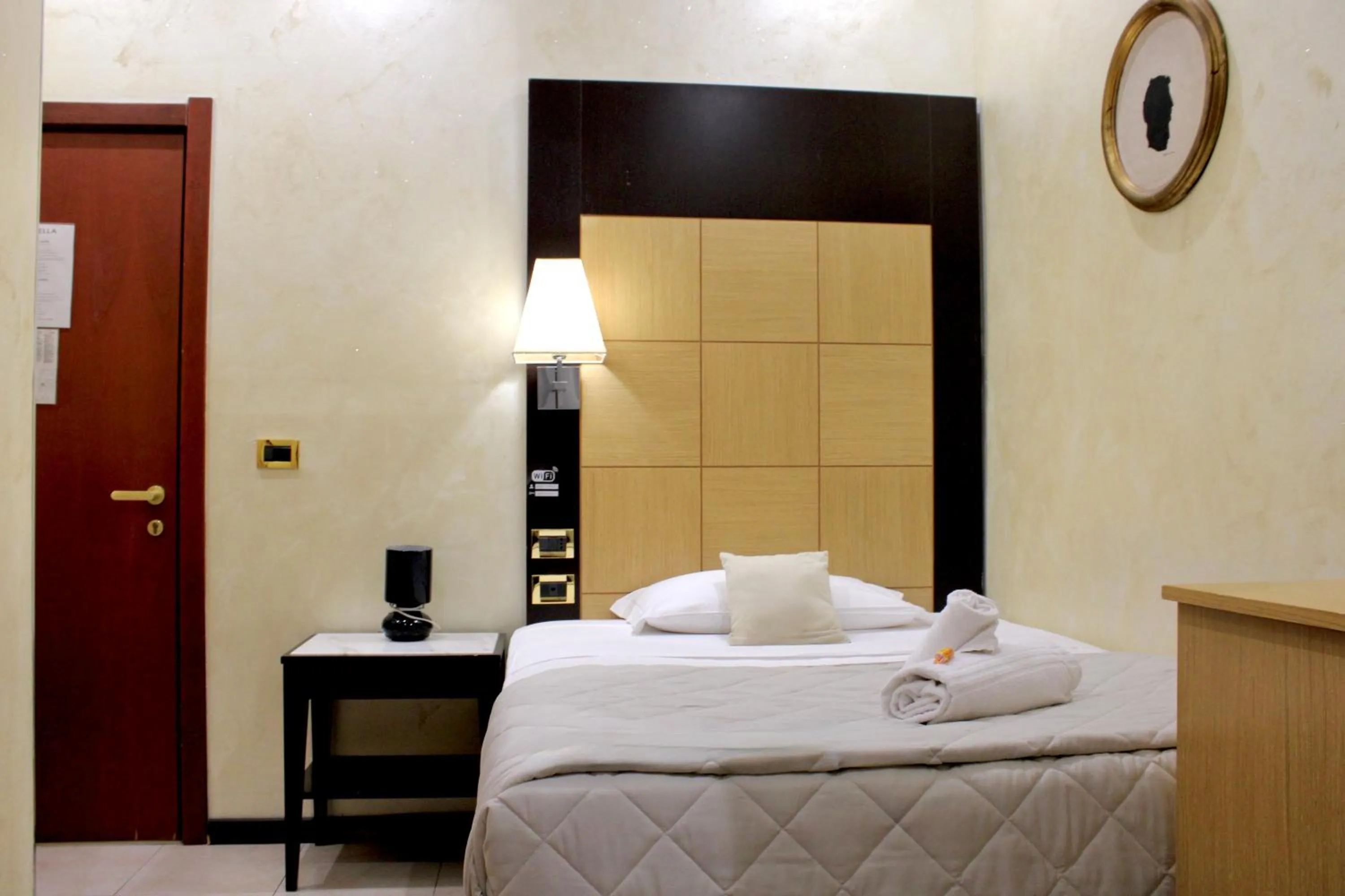 Photo of the whole room, Bed in Hotel Fiorella Milano