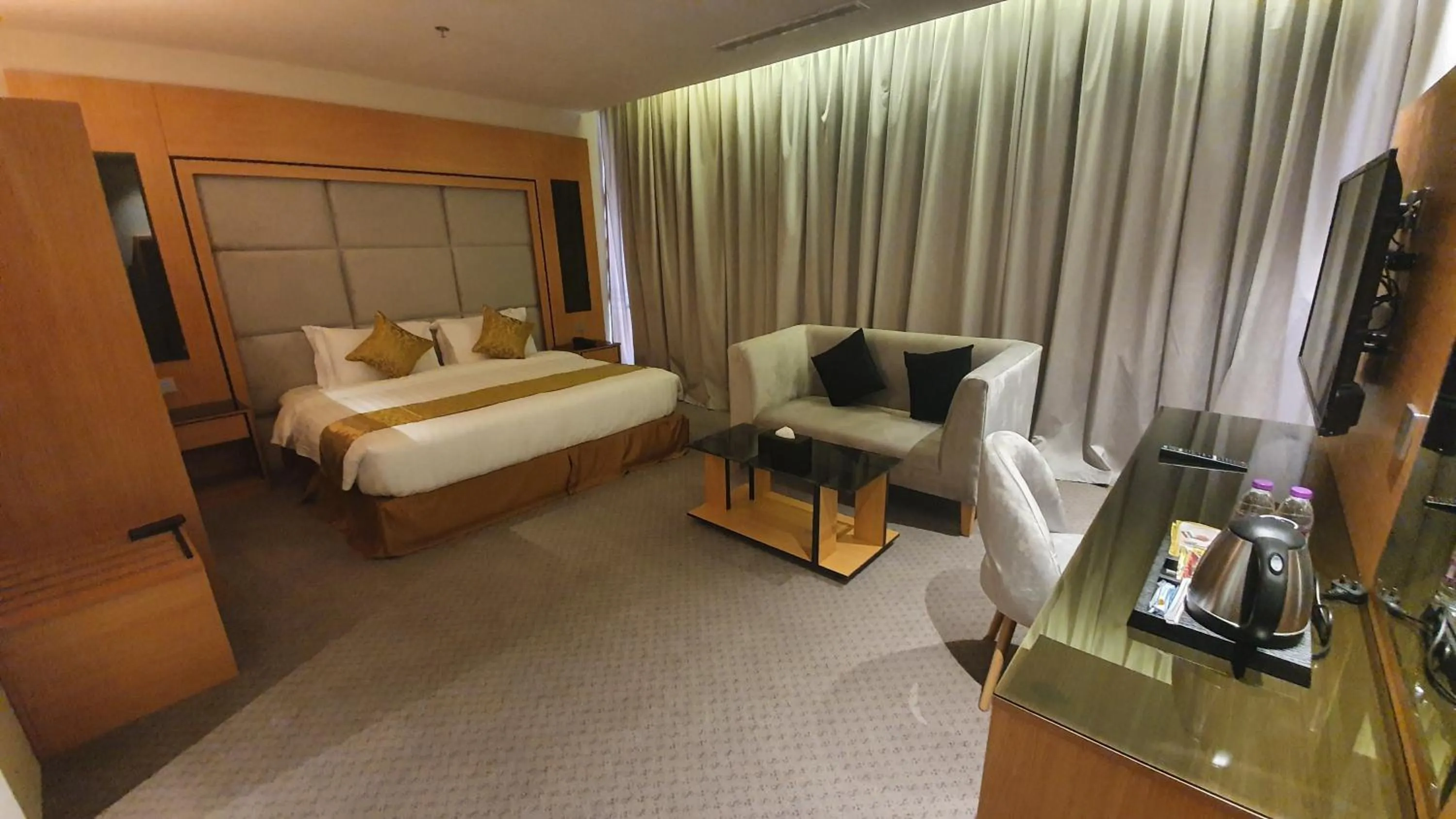 Seating area, Bed in Al Rayyan Tower