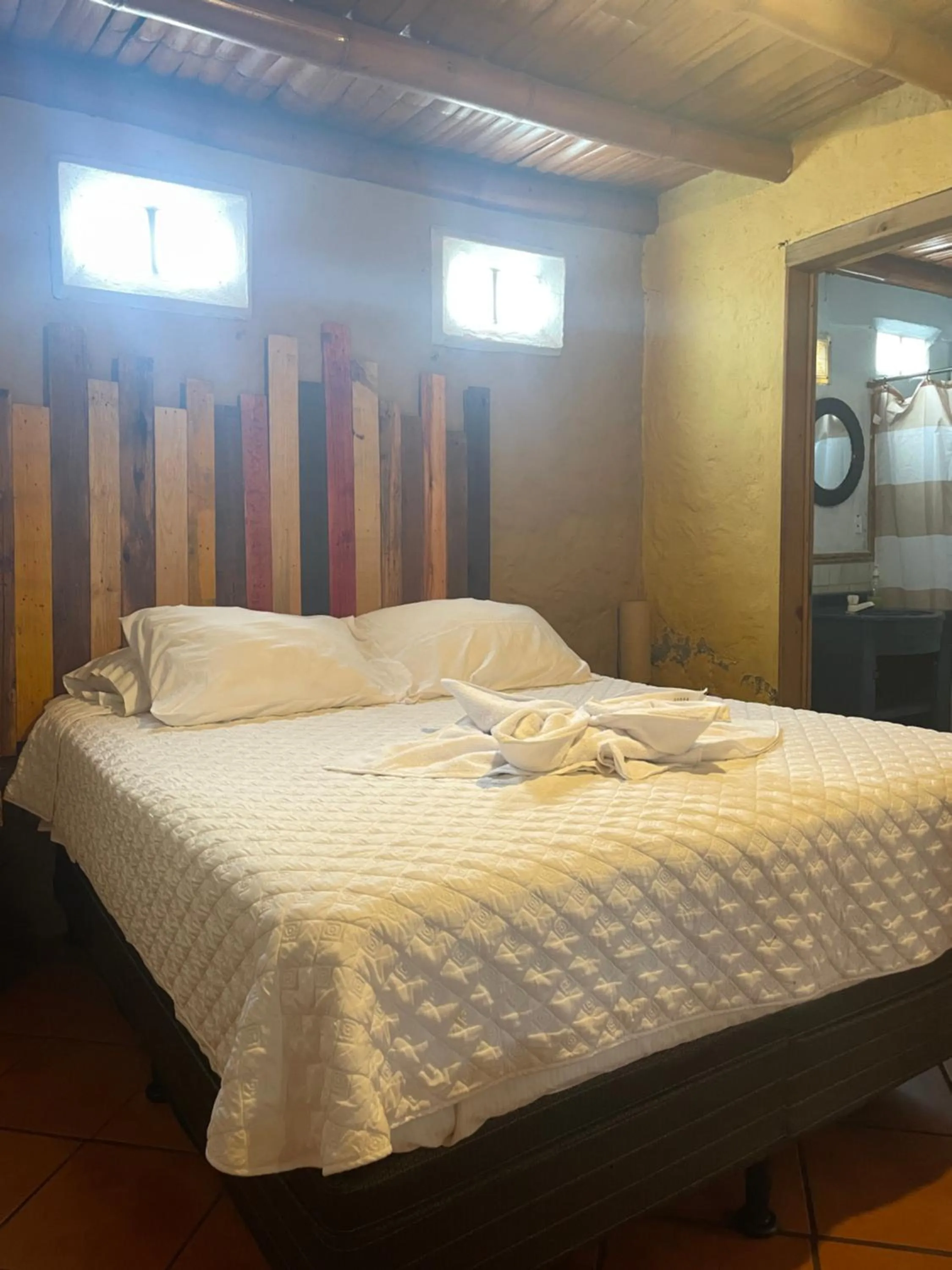 air conditioner, Bed in Johnnys Place Hotel