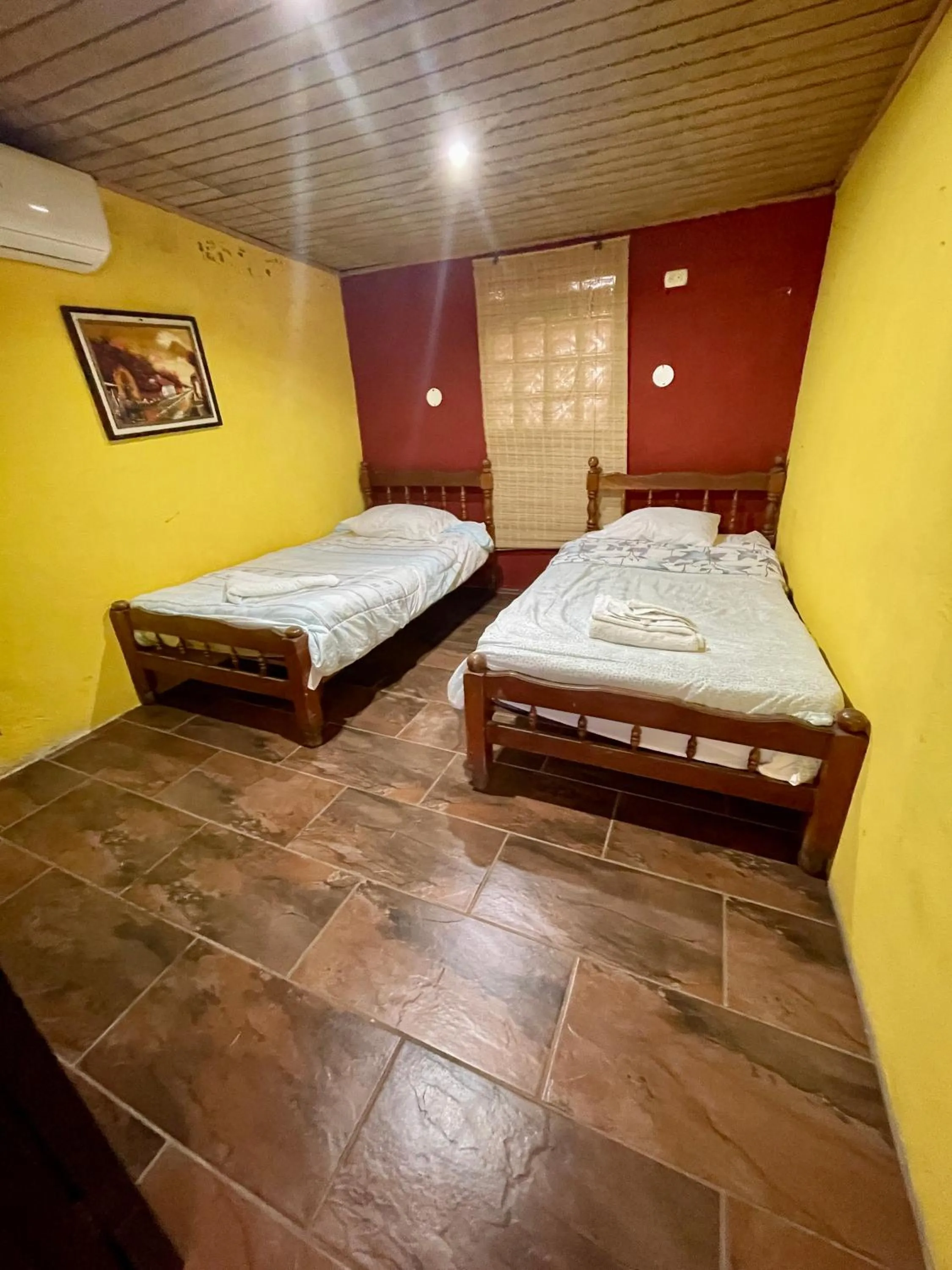 air conditioner, Bed in Johnnys Place Hotel