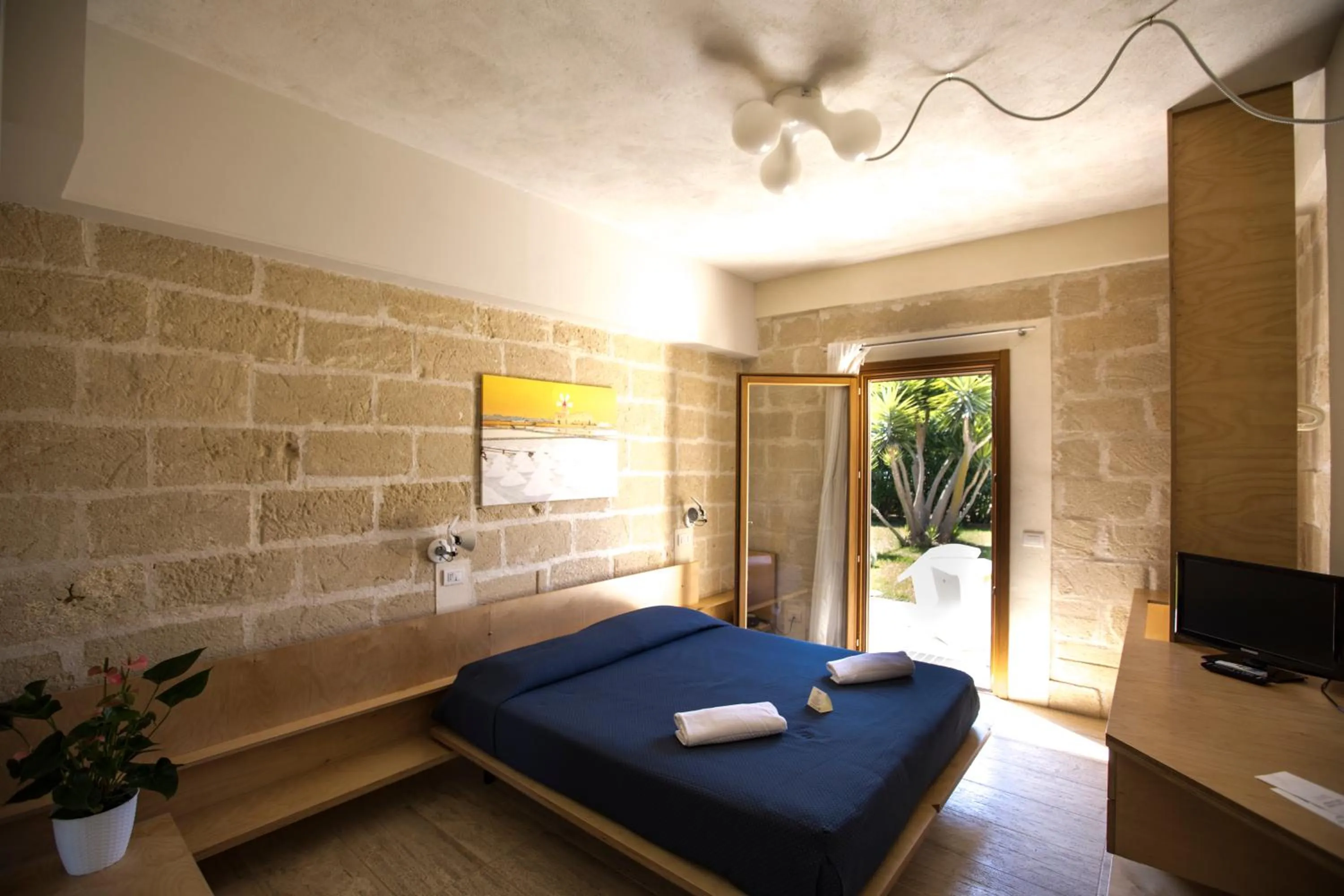 Bed in Cave Bianche Hotel