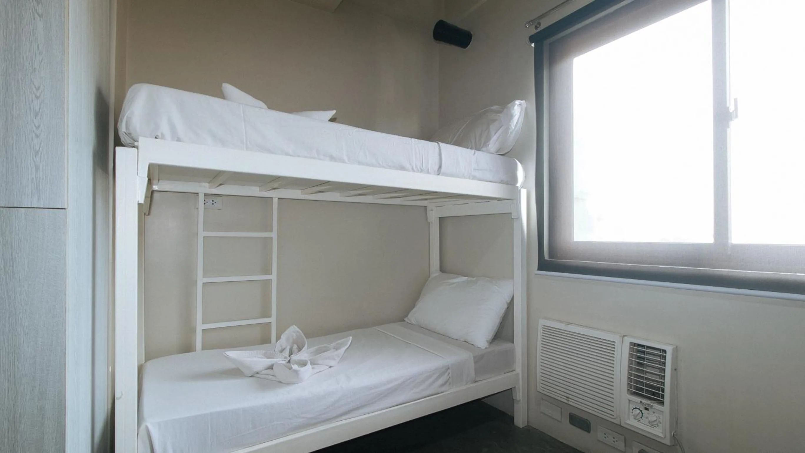 Bedroom in Filmore Suites Makati by RedDoorz