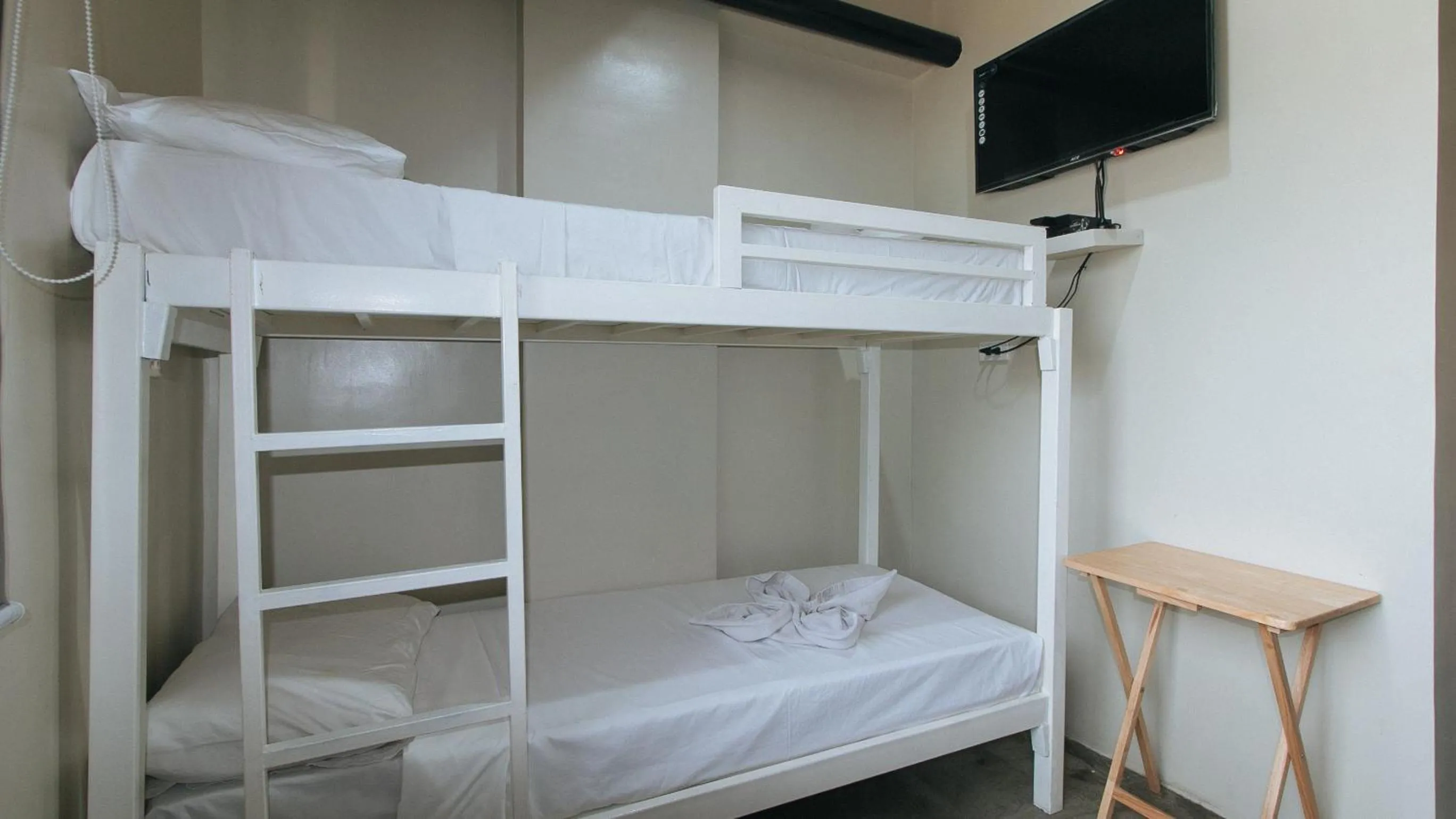 Bed in Filmore Suites Makati by RedDoorz