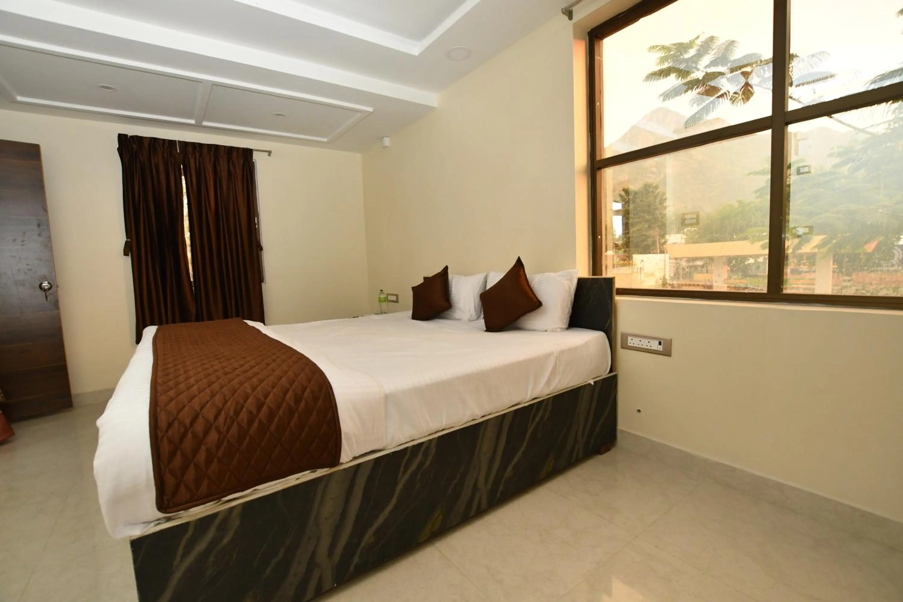 Mountain view, Bed in VIJAY BALAJI MAHAL A/C