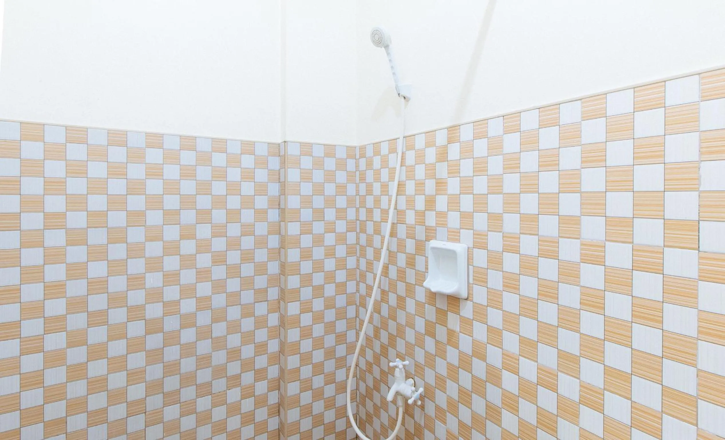 Shower in Golden Sunrise Hotel I by RedDoorz