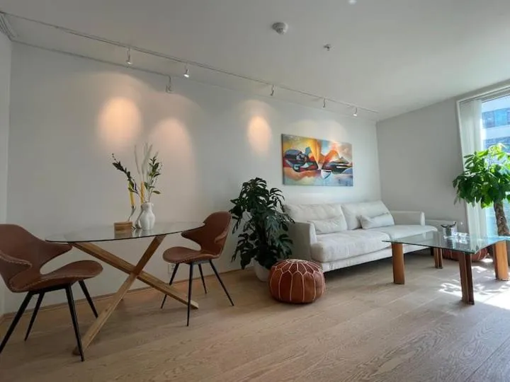 Living room in Bright & exclusive 1BR in Prime Location, located on water in Oslo center with see view to Oslo fjord