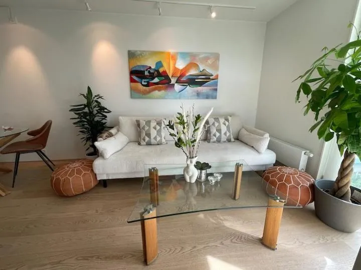 Living room in Bright & exclusive 1BR in Prime Location, located on water in Oslo center with see view to Oslo fjord