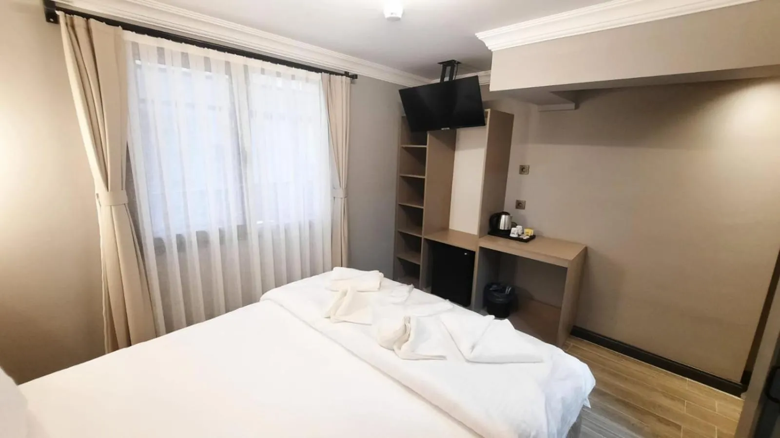 Bed in TALLES CITY HOTEL