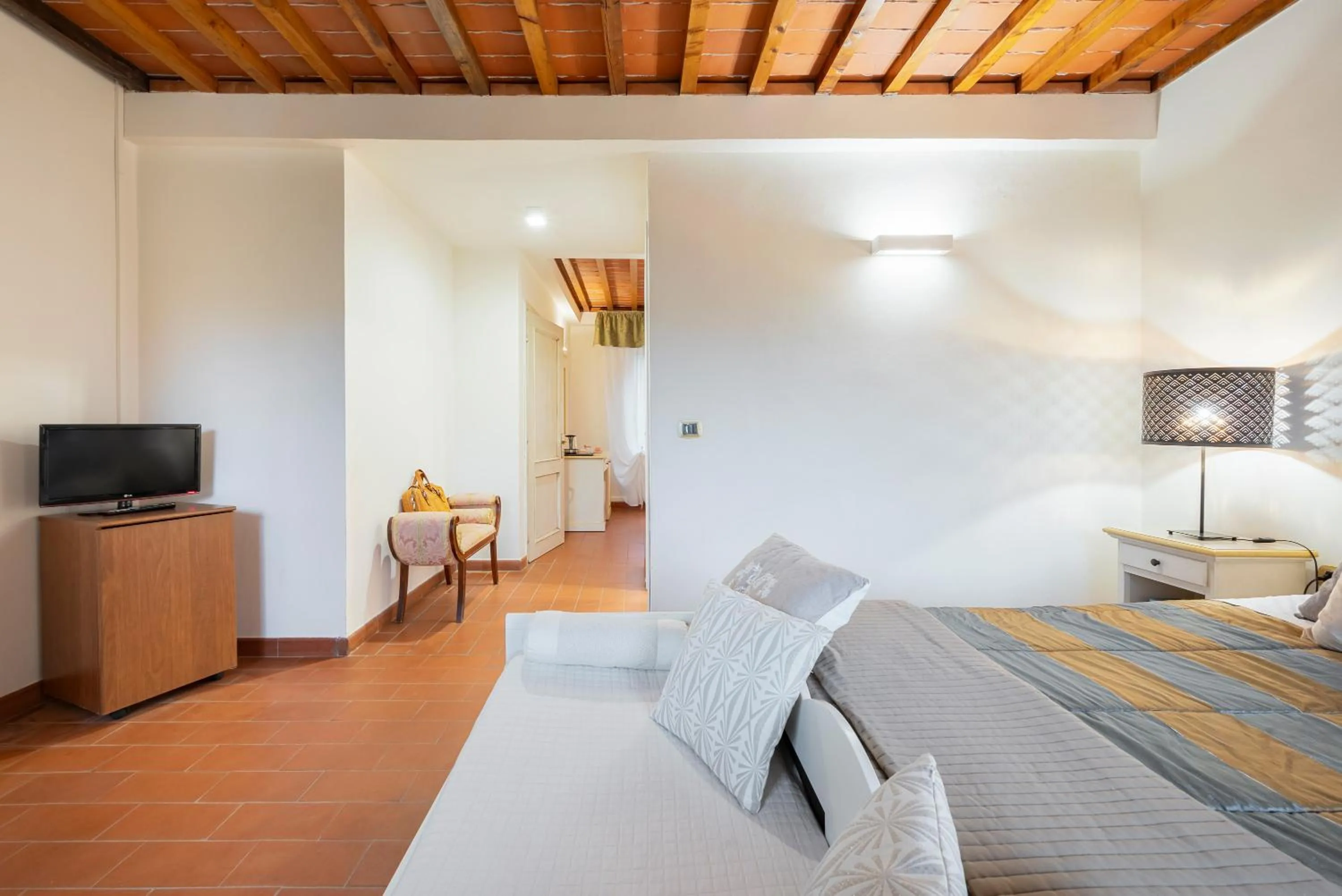 Communal lounge/ TV room, Bed in Cascina De' Fagiolari