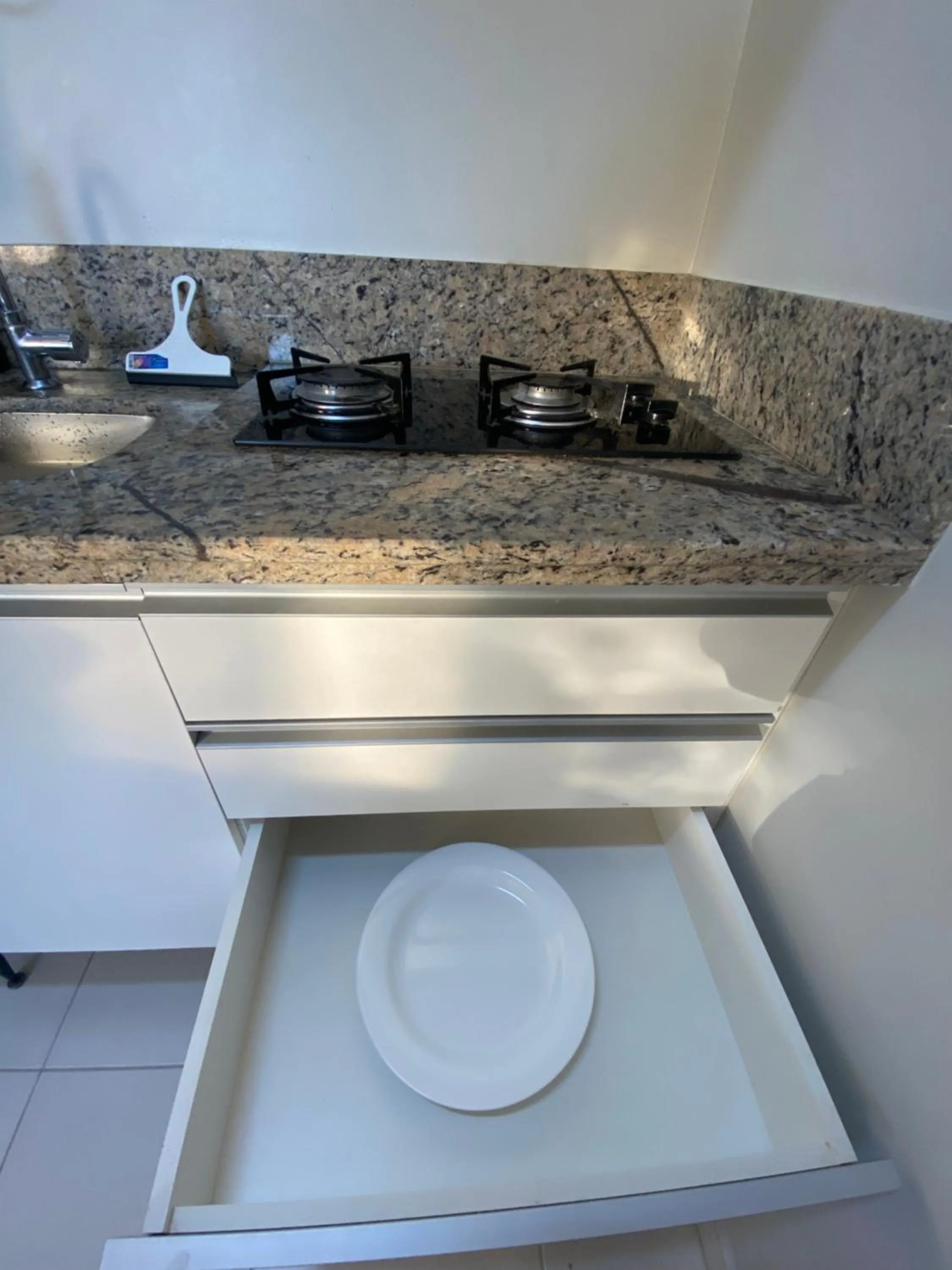 Kitchen or kitchenette in Prive Boulevard Suite Hotel