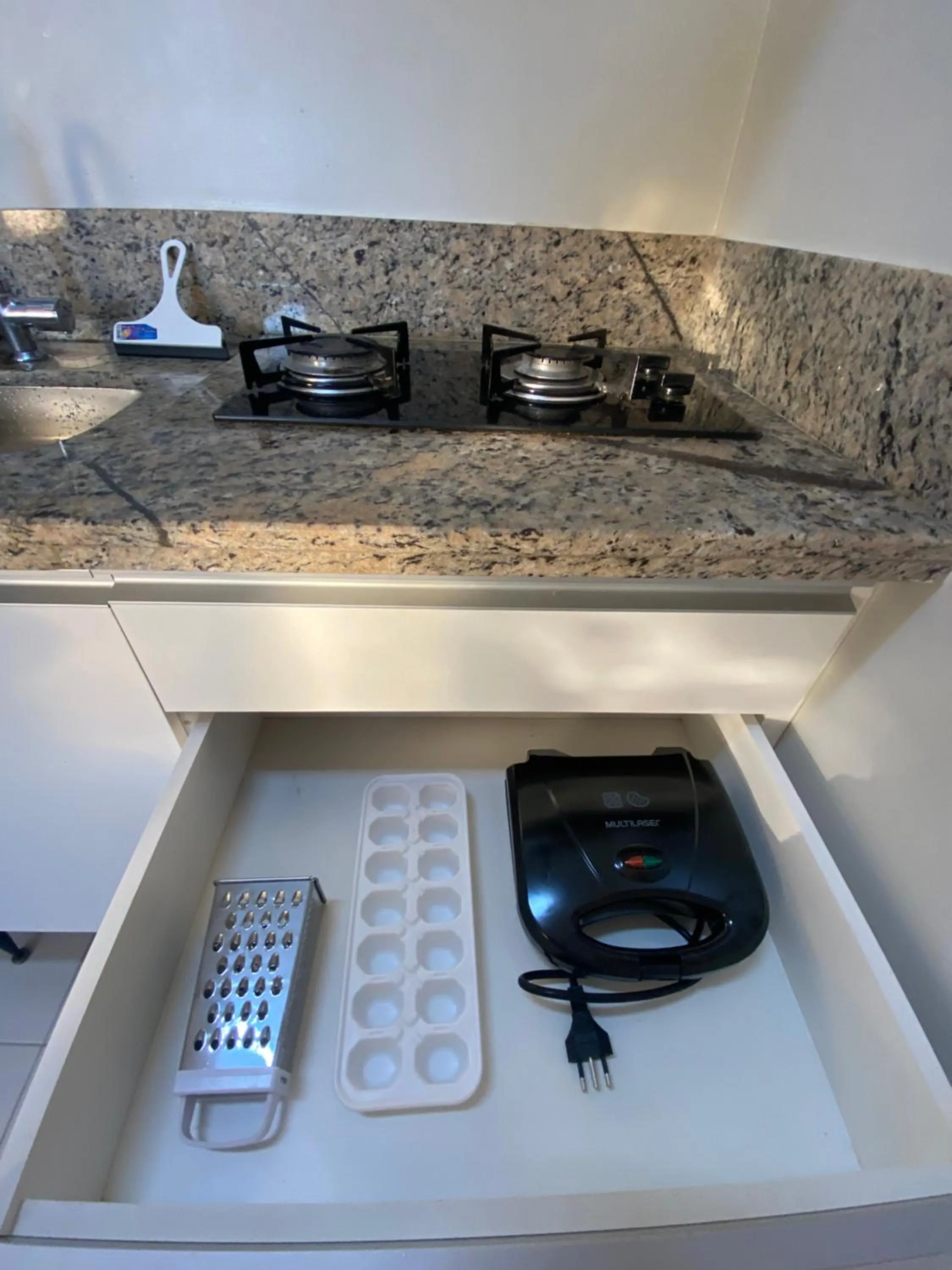 Communal kitchen in Prive Boulevard Suite Hotel