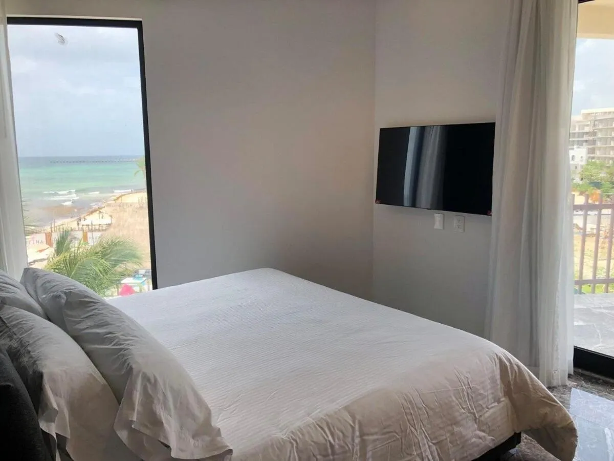 Bed in Deluxe Aparment Whit Beach & Ocean View 8 Pax