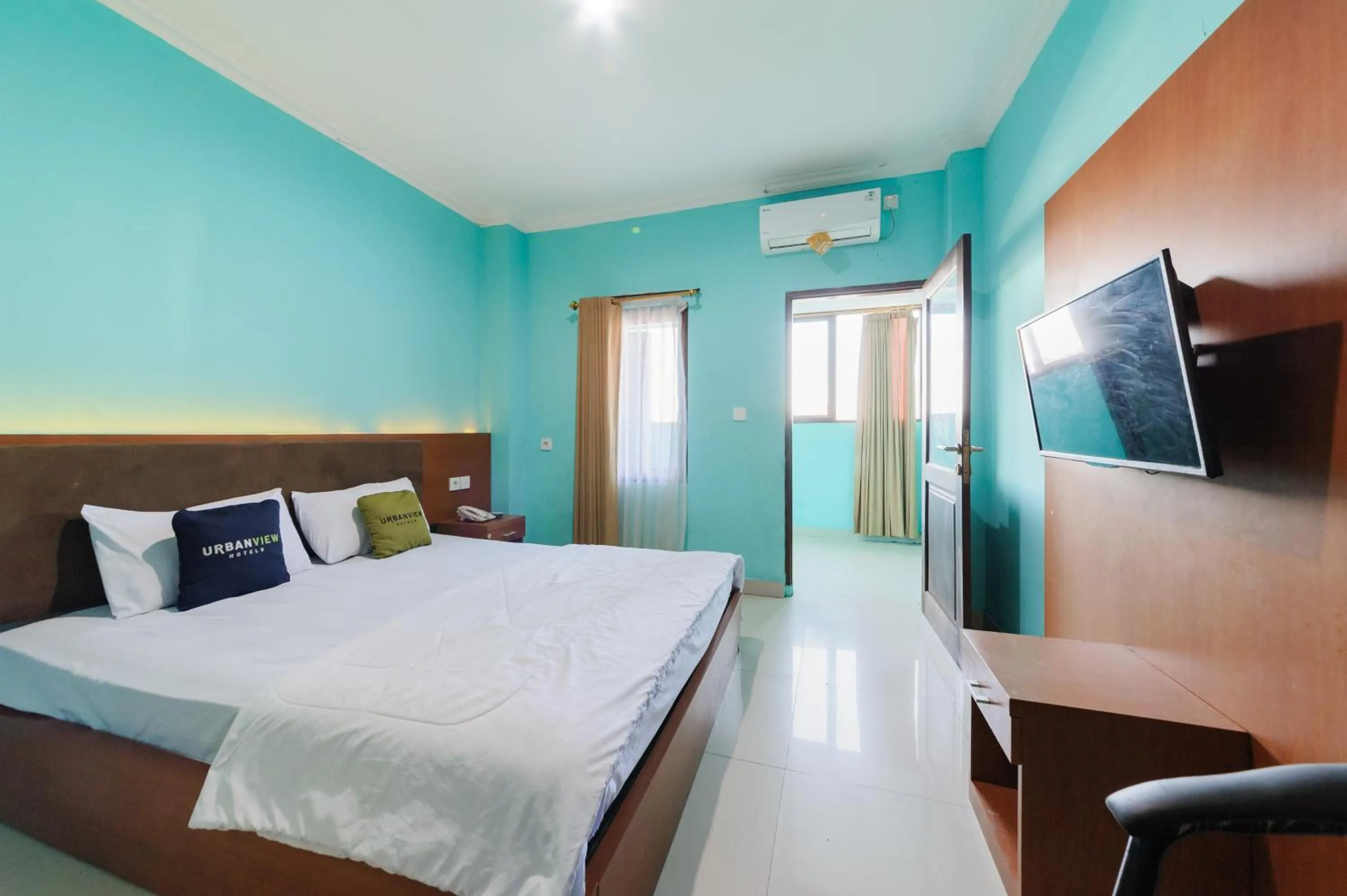 Bedroom, Bed in Gita Inn Bali RedPartner