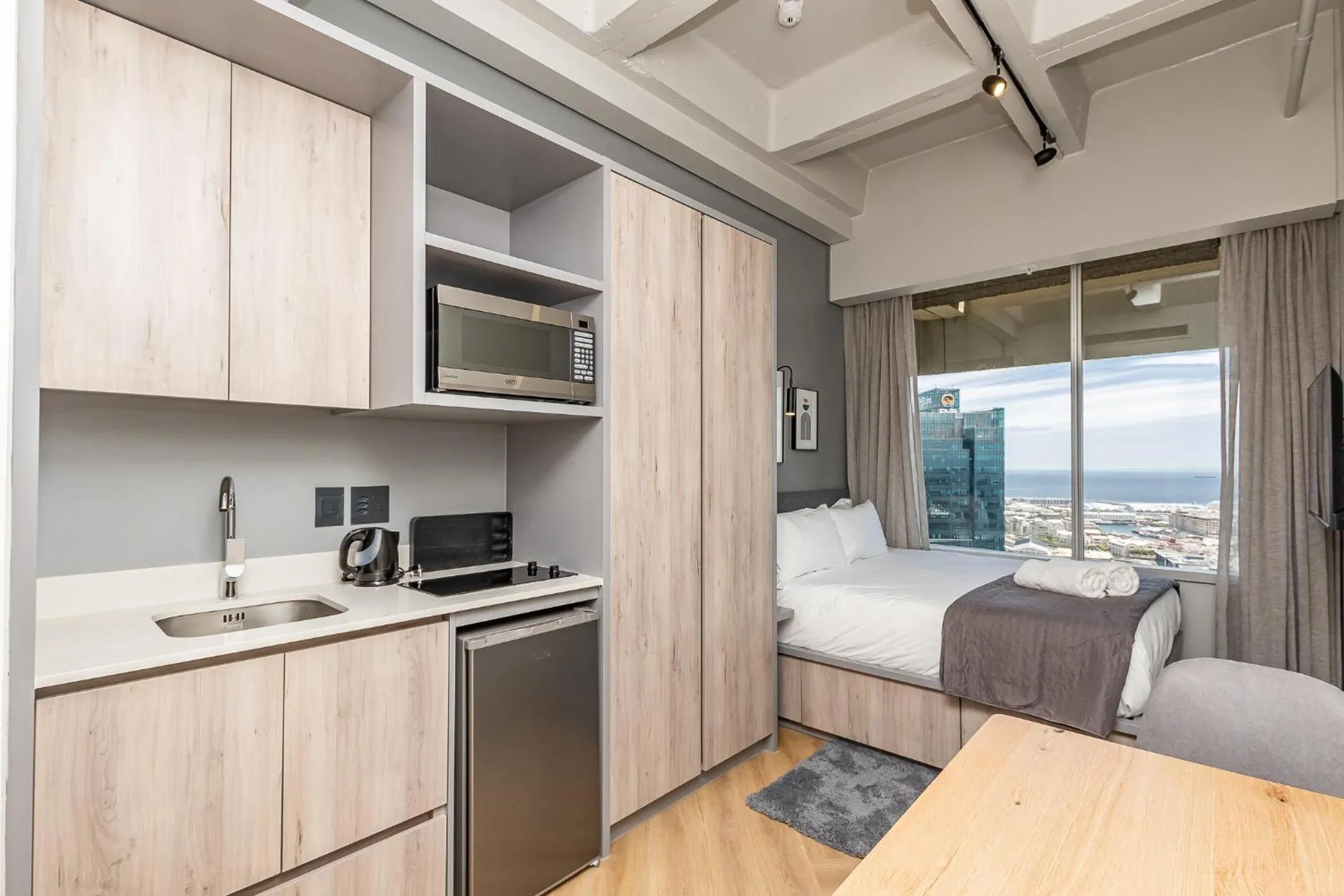 Kitchen or kitchenette, Bed in One Thibault Hotel by ITC Hospitality