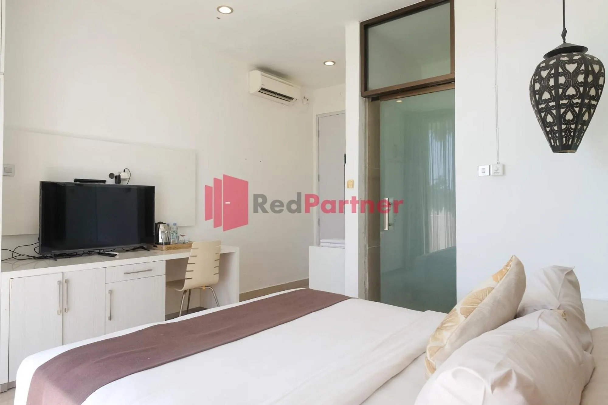 Bed in Sawah Joglo Boutique Villa Mitra RedDoorz