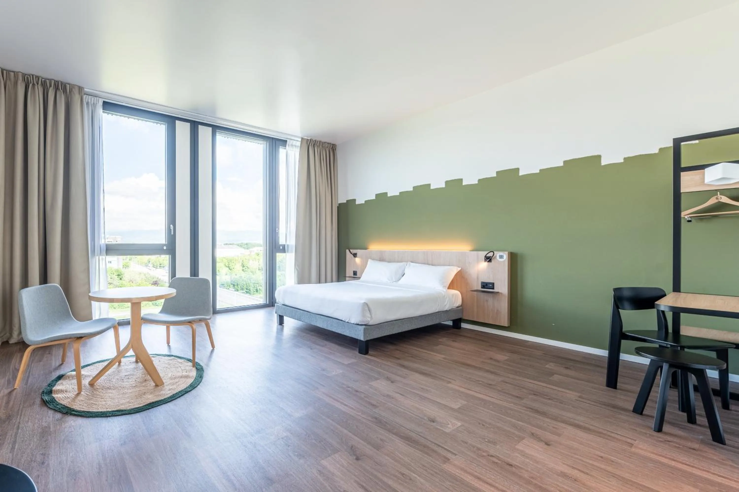 View (from property/room), Bed in B&B HOTEL Geneva Airport