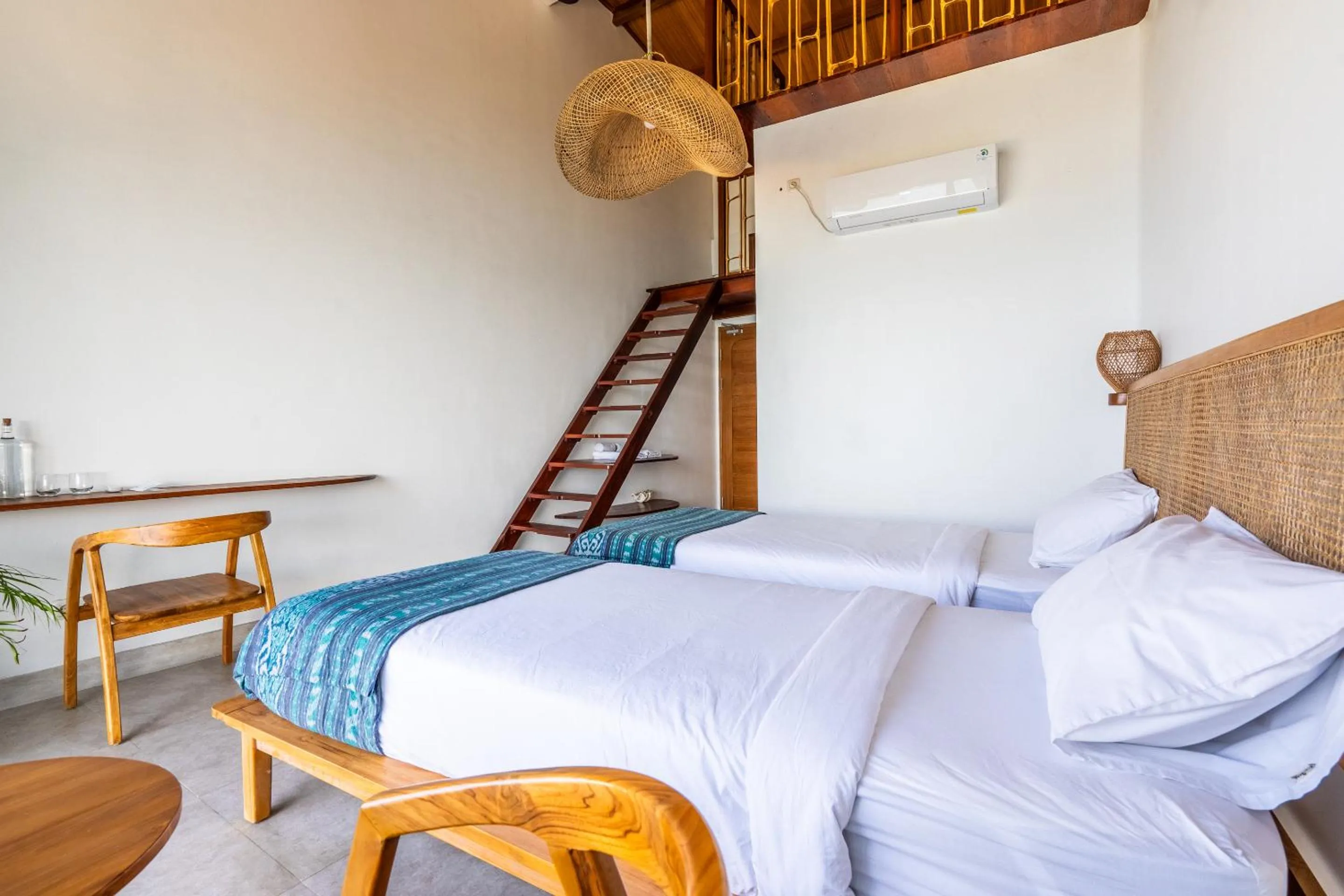 Bed in Inlight Lombok Beach Hotel