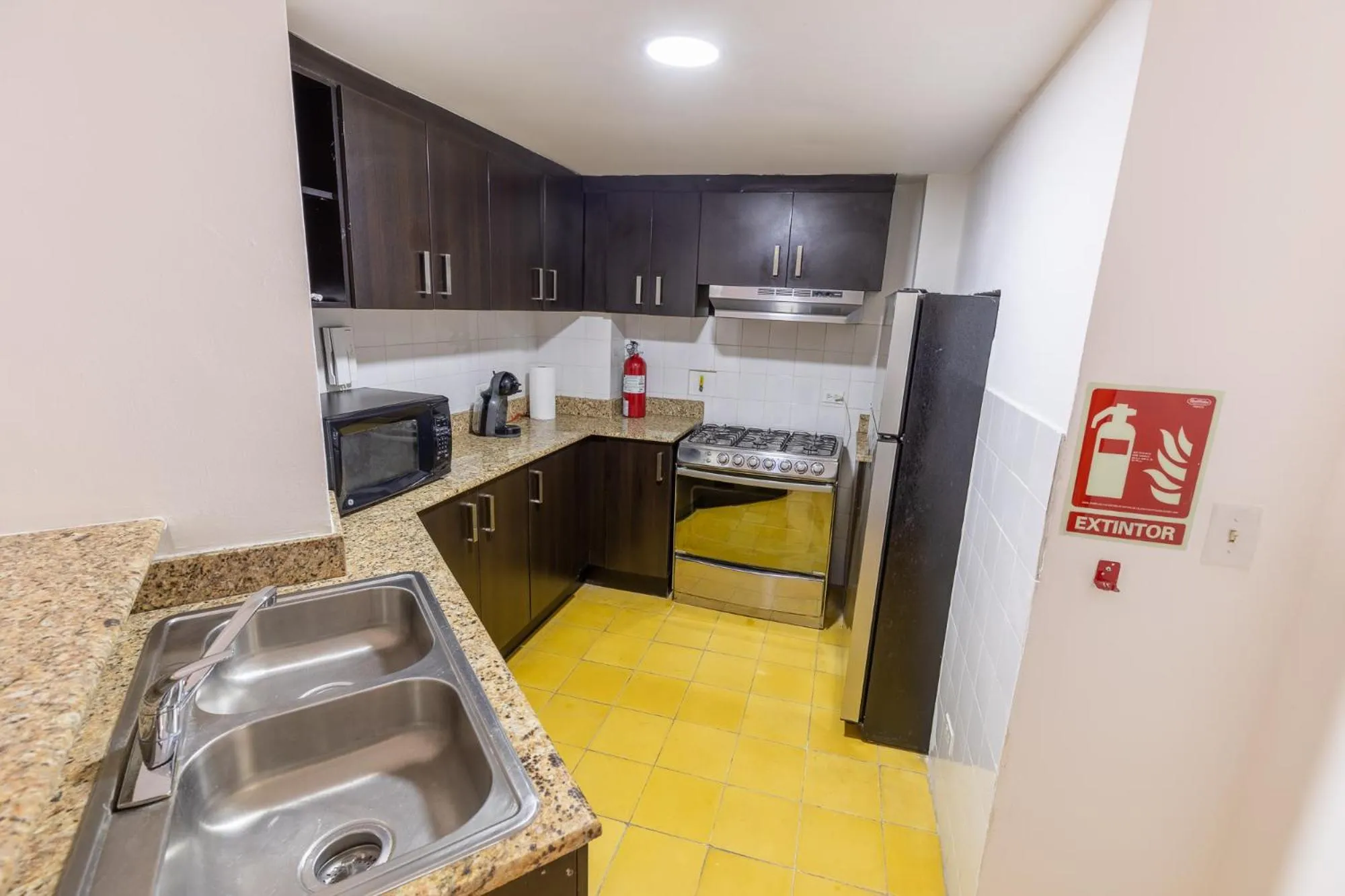 Kitchen or kitchenette in Oasis Hotel