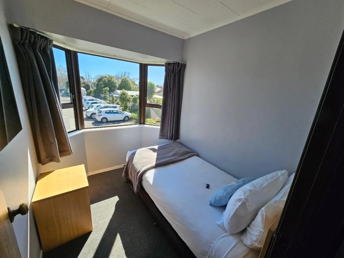 Bed in Hacienda Motor Lodge