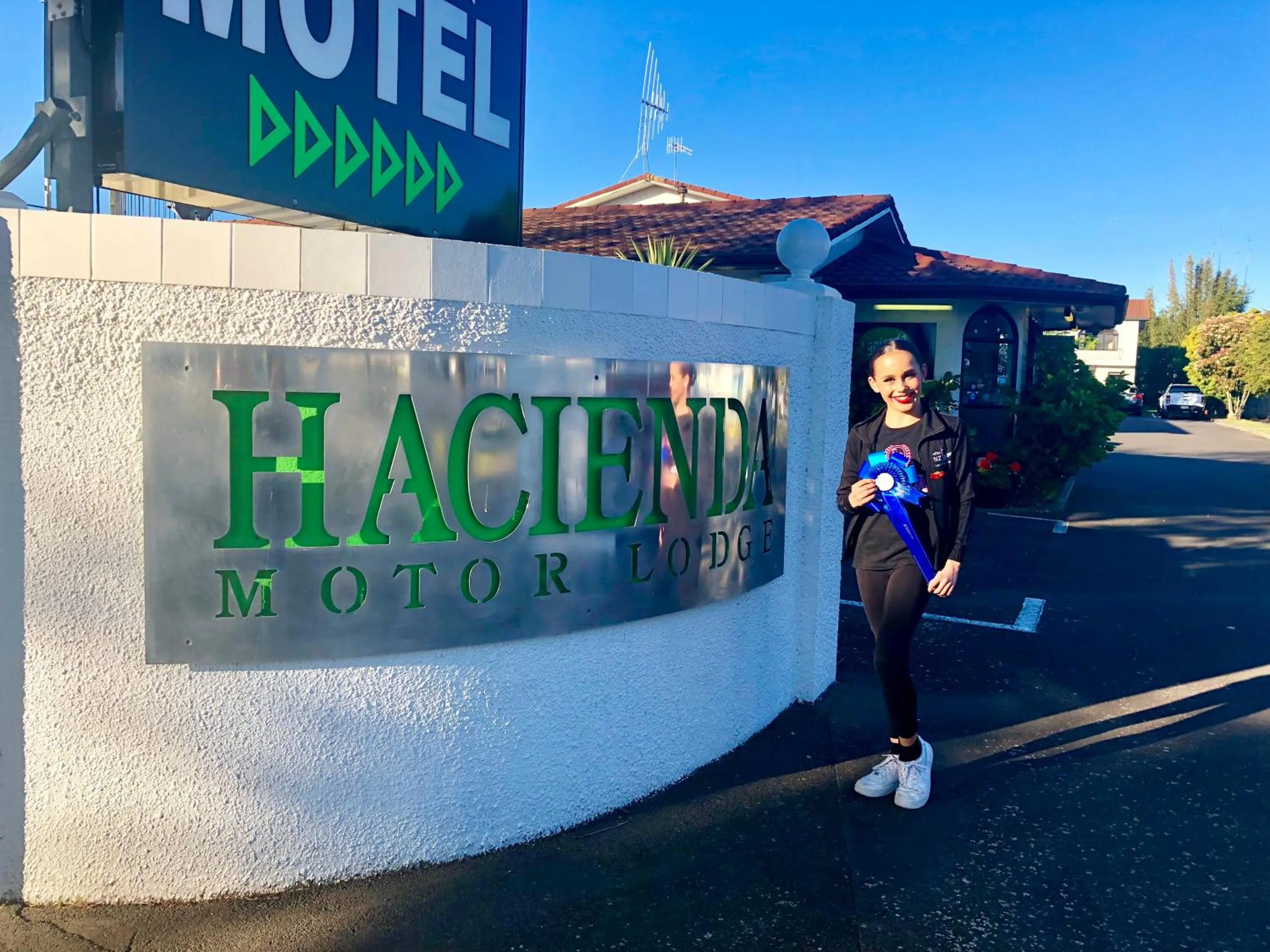 Property logo or sign in Hacienda Motor Lodge