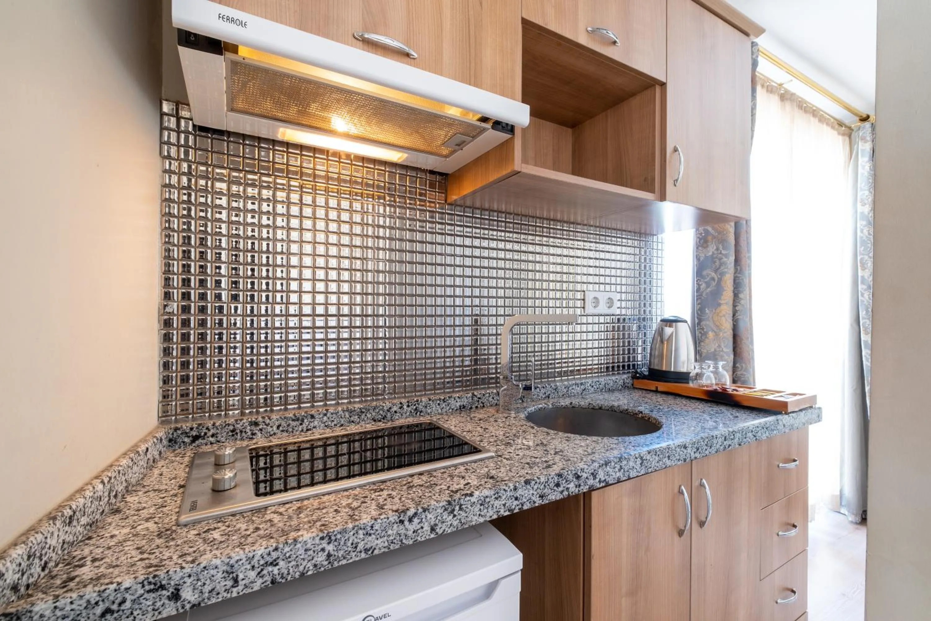 Kitchen or kitchenette in Lavin Hotel & Suites