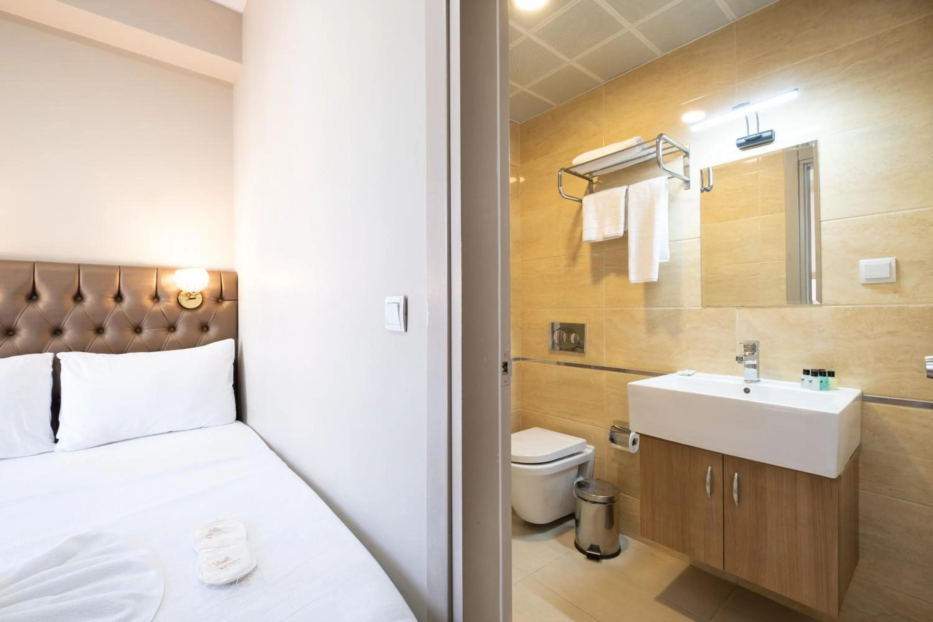 Bed in Lavin Hotel & Suites