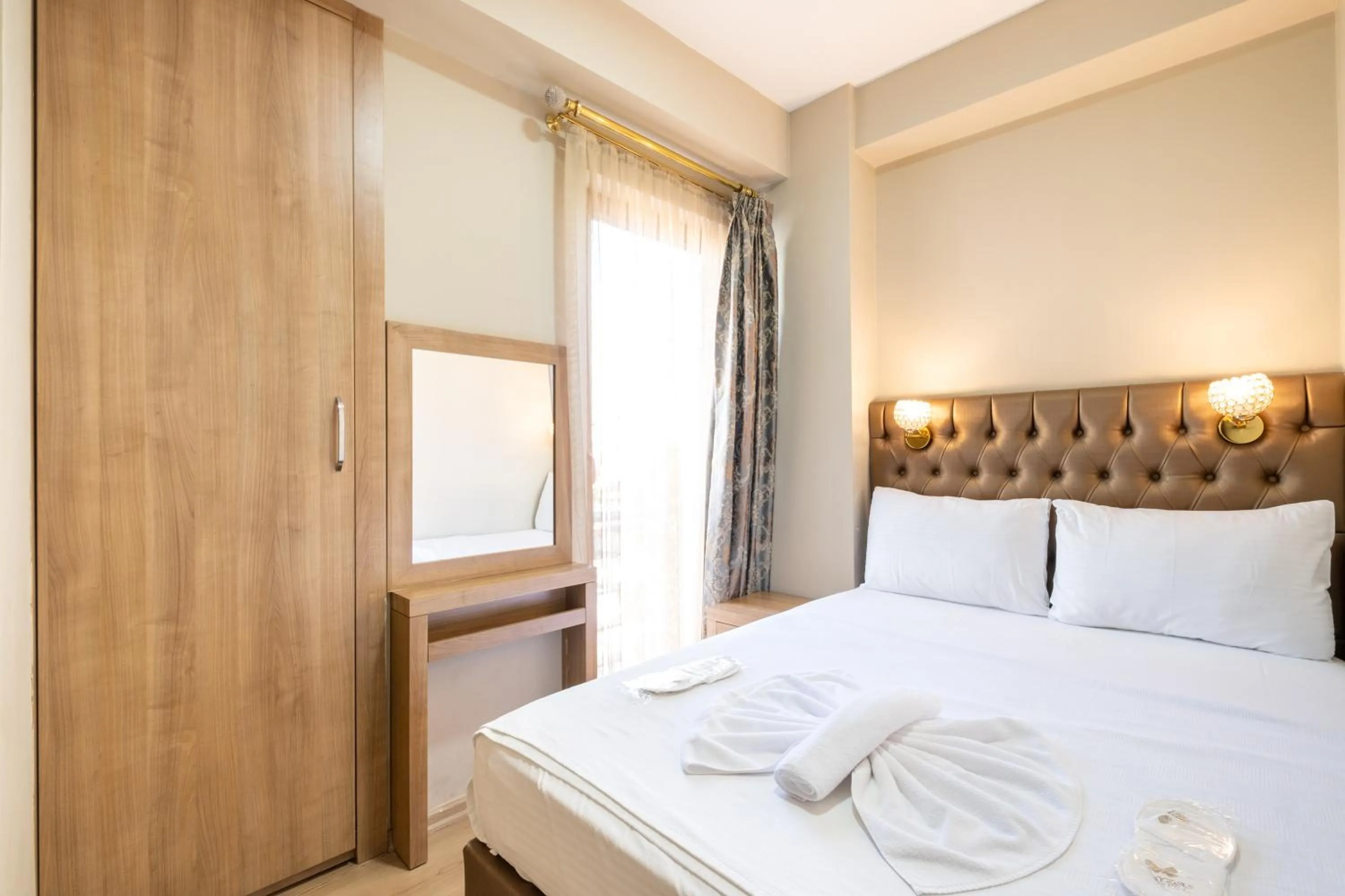 Bed in Lavin Hotel & Suites