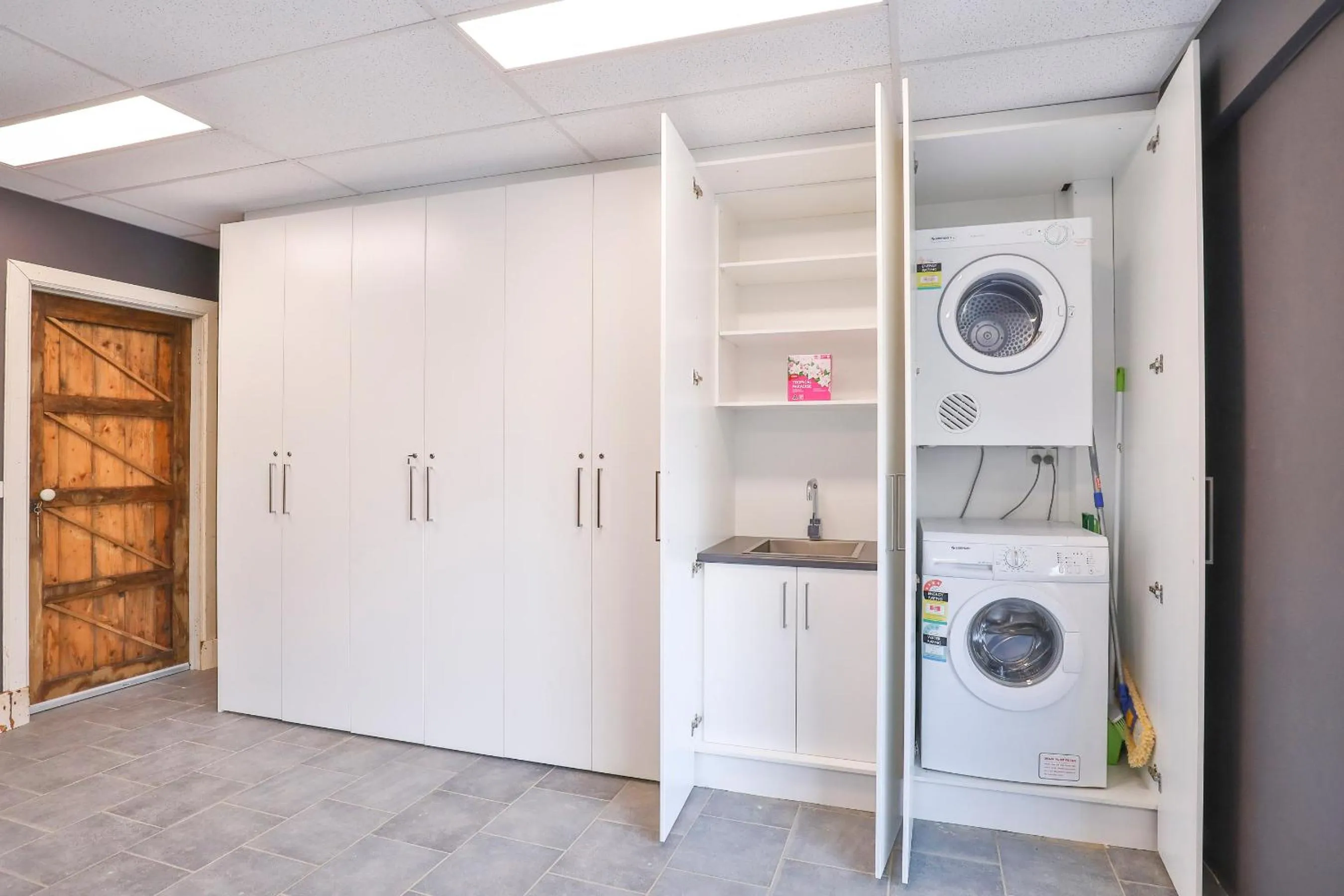 washing machine in Indulge Apartments - Eighth