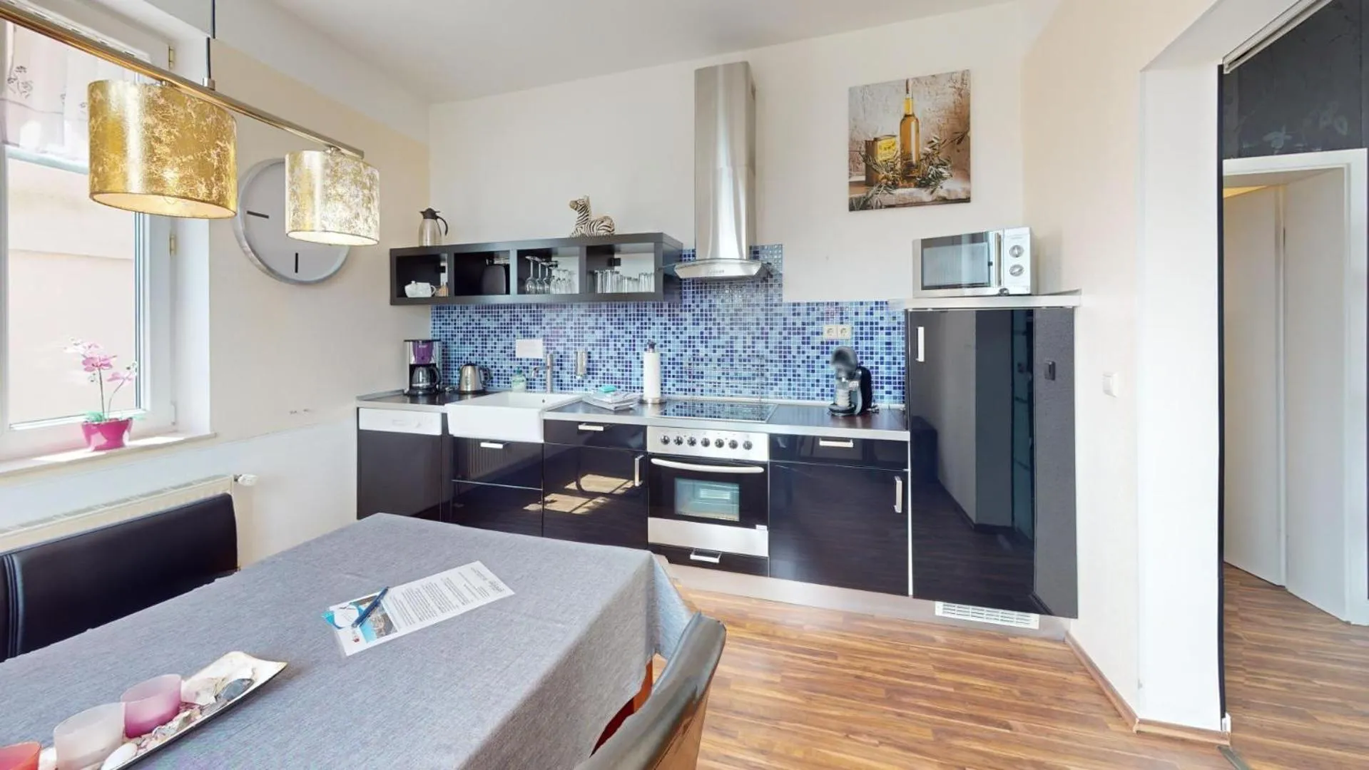 Kitchen or kitchenette in Apartments am Sund
