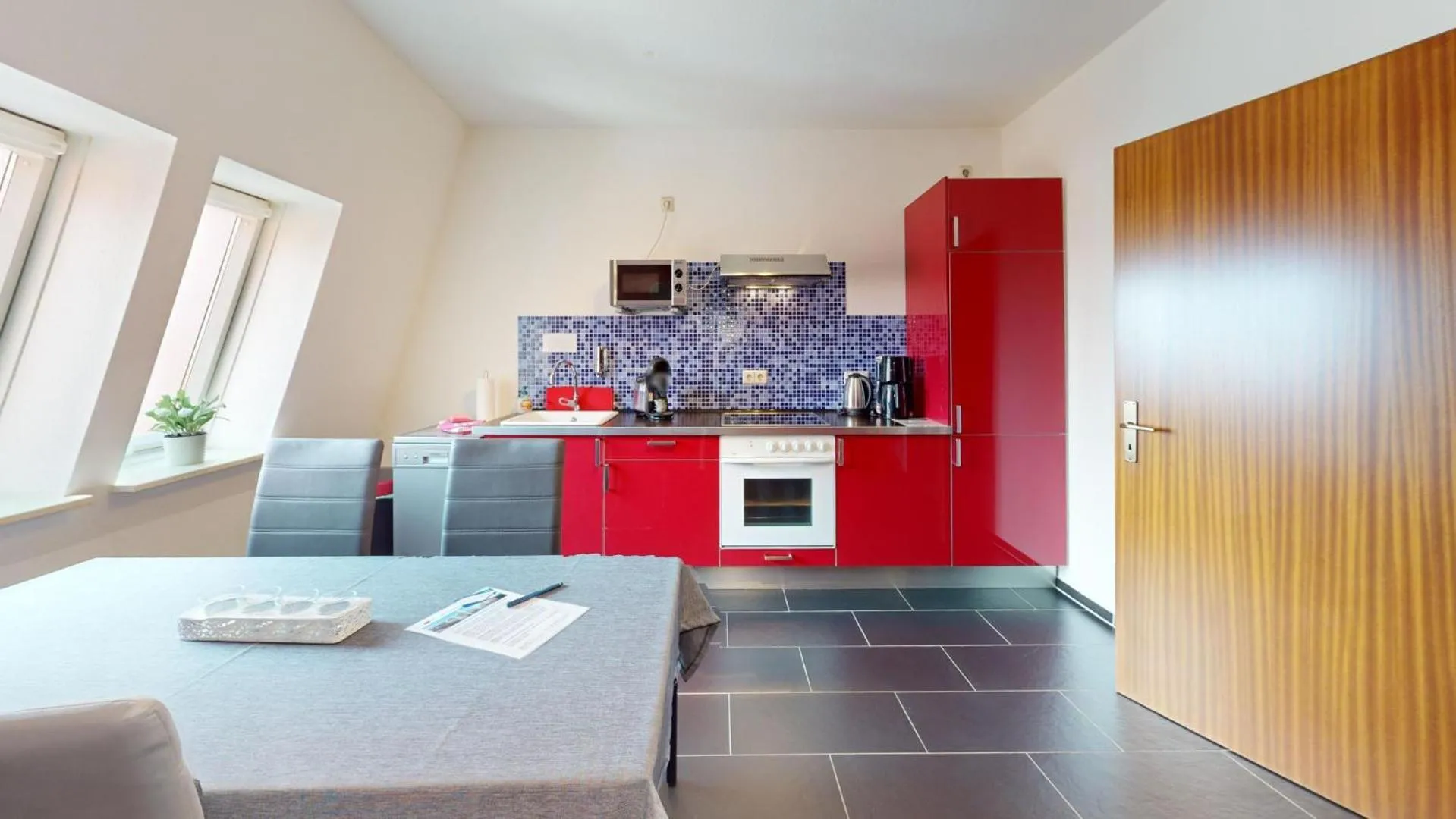 Kitchen or kitchenette in Apartments am Sund