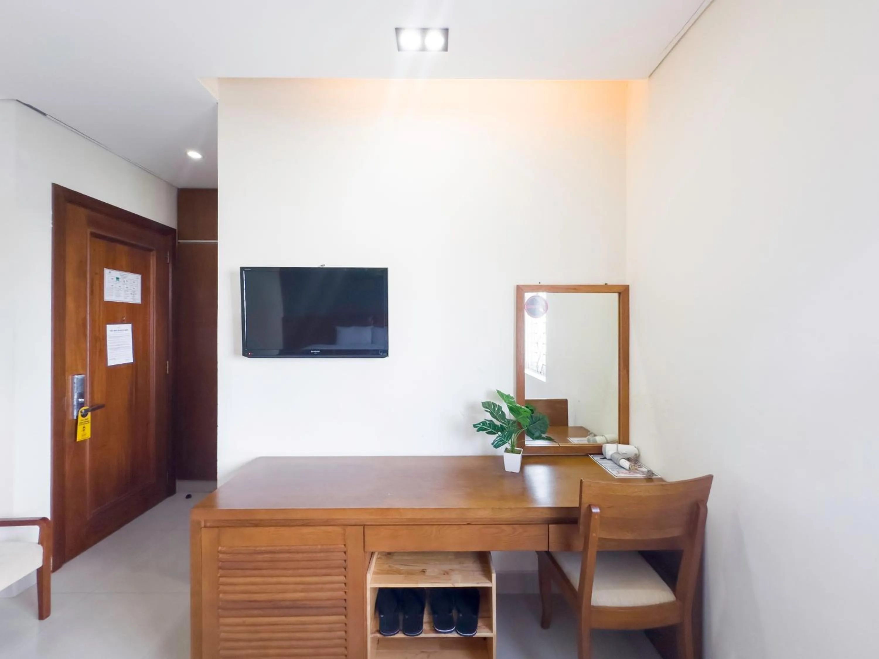 TV and multimedia in Doha Central Bliss Danang Hotel by Haviland