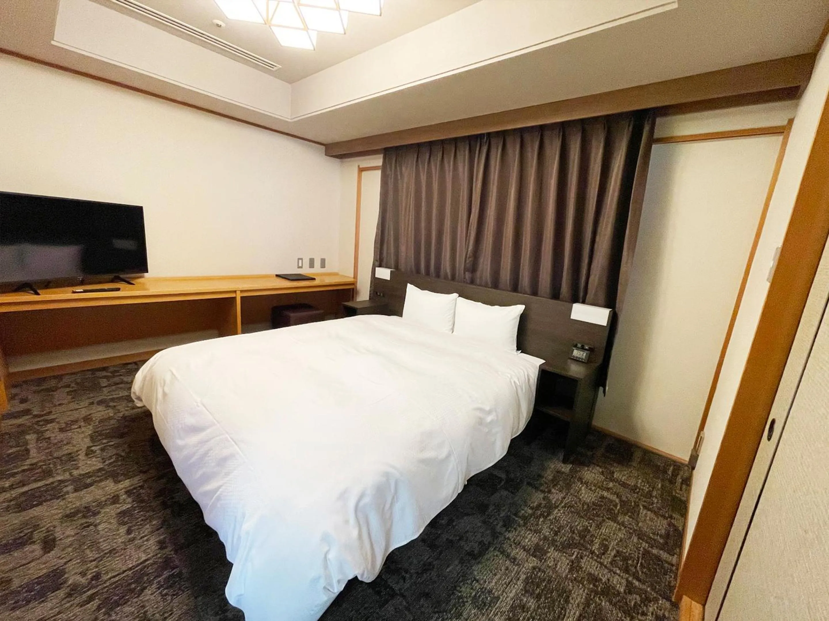 Photo of the whole room, Bed in Grandvrio Hotel Unazukionsen
