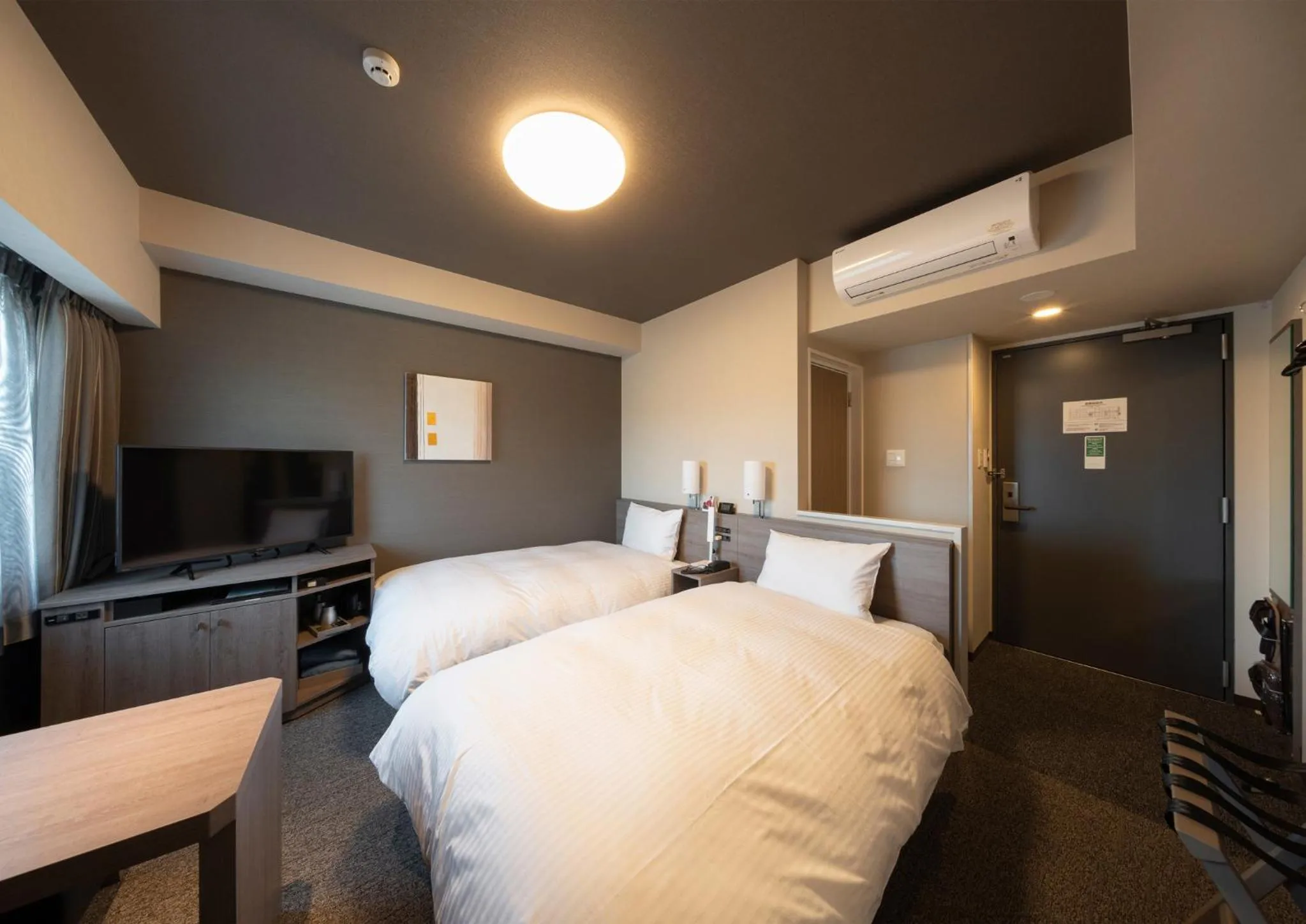 Photo of the whole room, Bed in Hotel Route Inn Osaka Izumifuchu