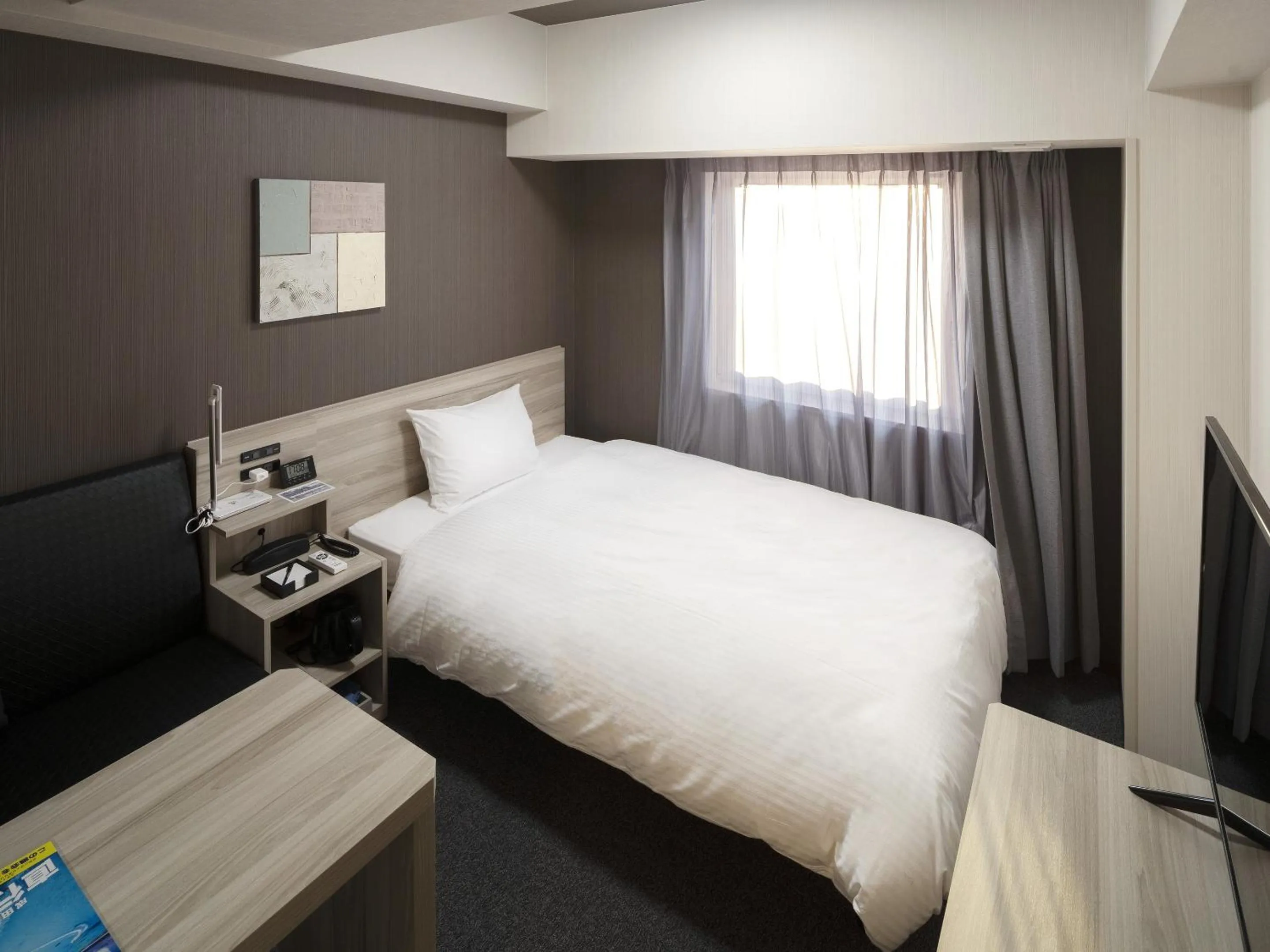 Photo of the whole room, Bed in Hotel Route Inn Matsuyama -Katsuyama Dori-