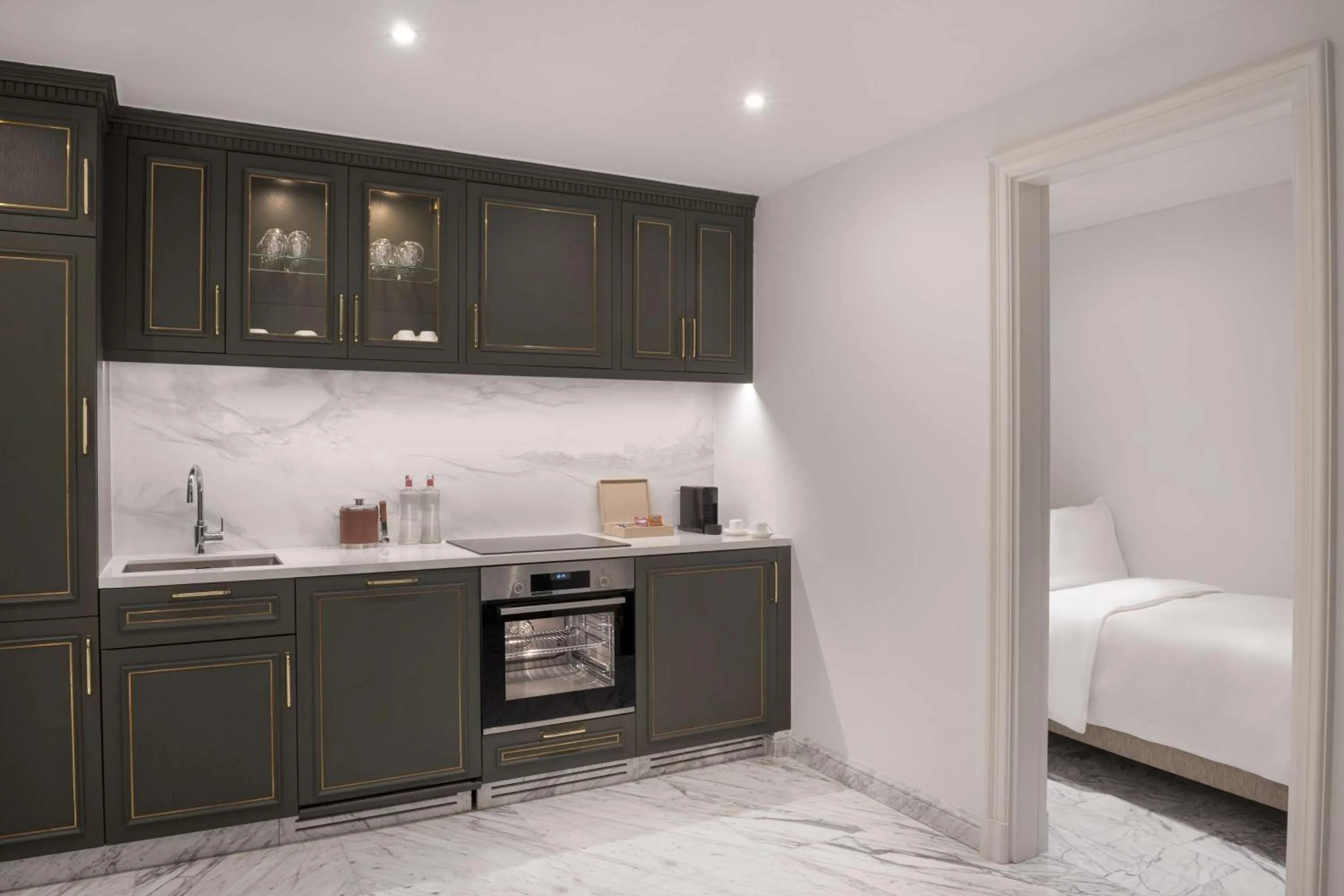 Kitchen or kitchenette, Bed in The Plaza Doha, LXR Hotels & Resorts