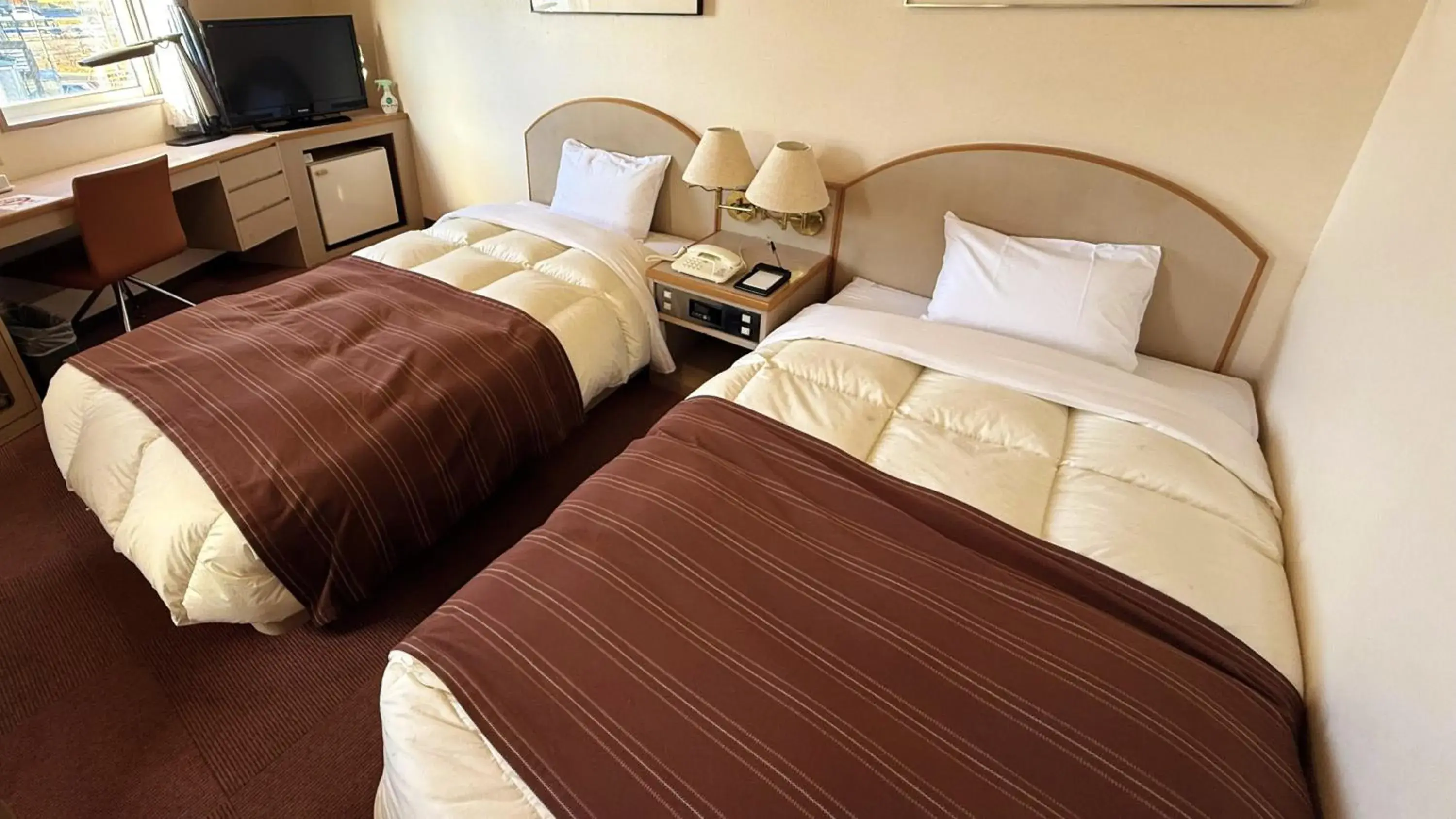 Bed in Hotel Sato Bed in Hotel Sato