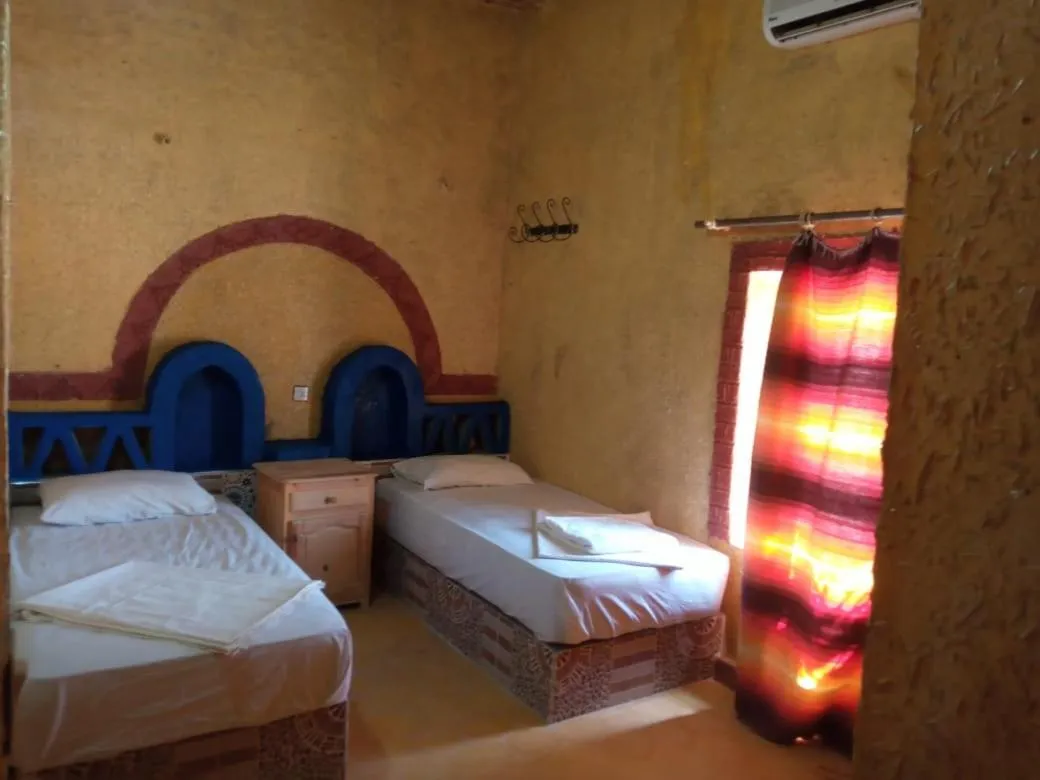 Bed in Les Pyramides Hotel Merzouga