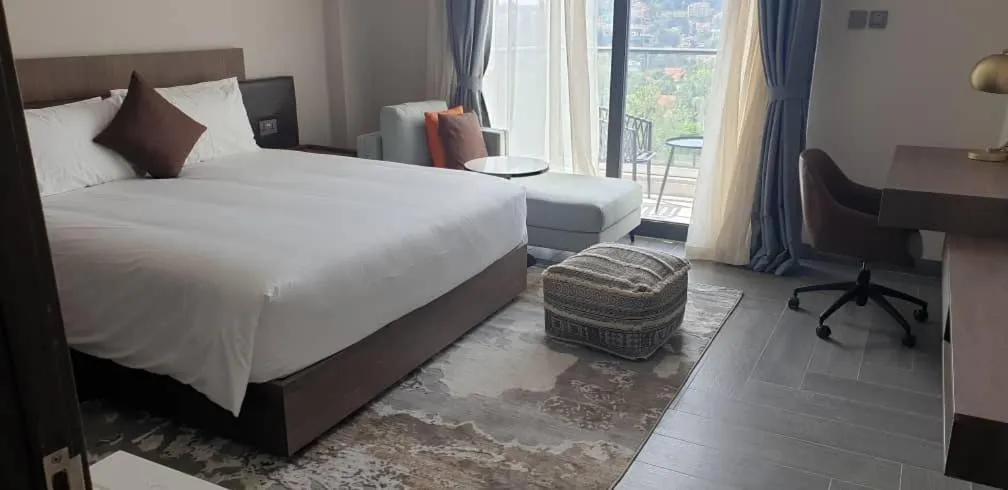 Bed in Zara Garden Hotel and Apartments