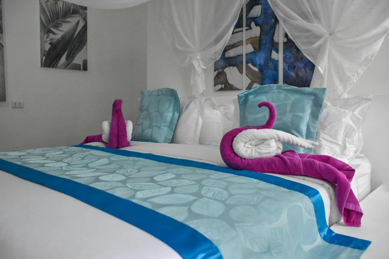 Bed in Carpe Diem Villas & Resort
