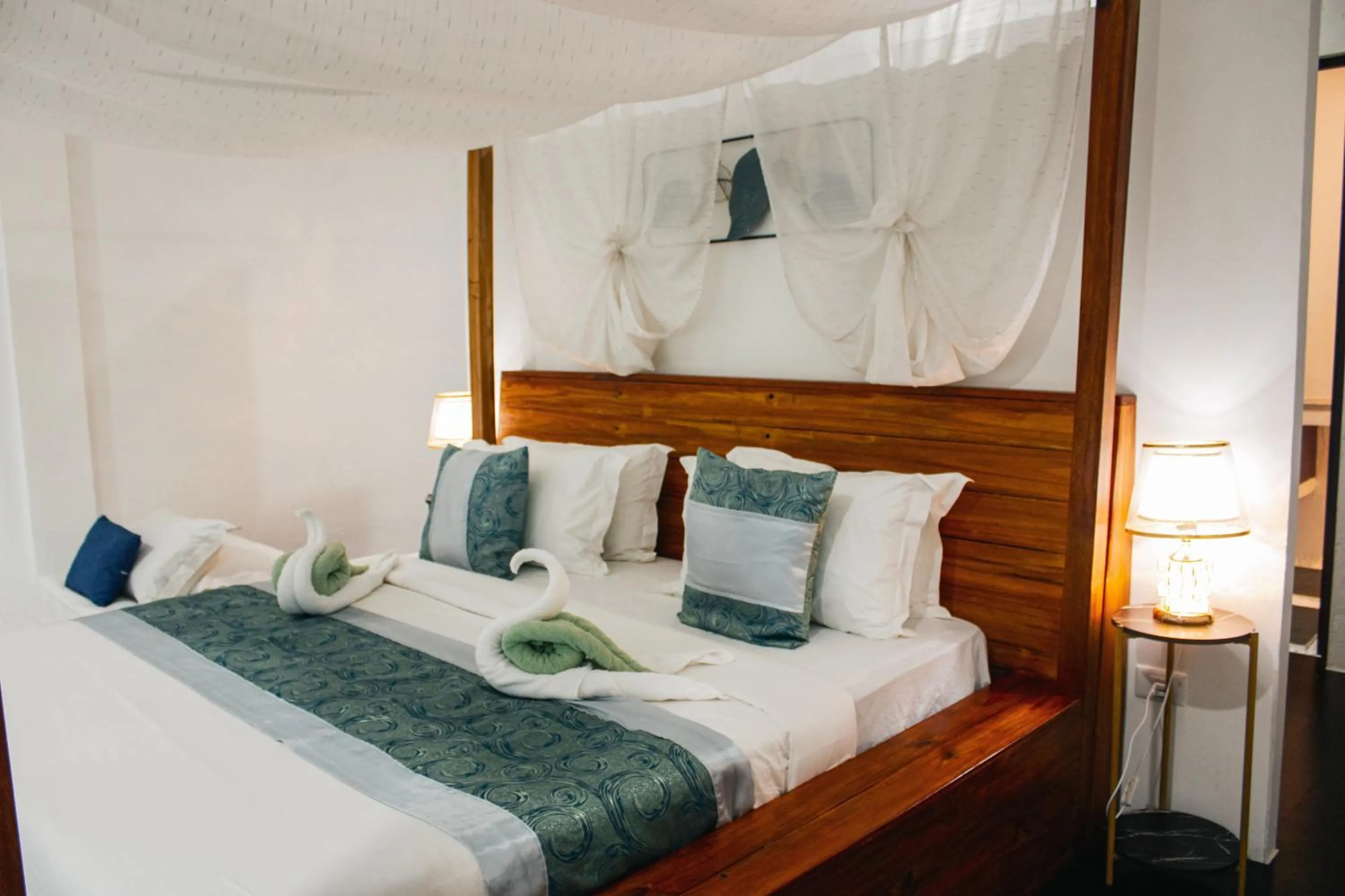 Bed in Carpe Diem Villas & Resort