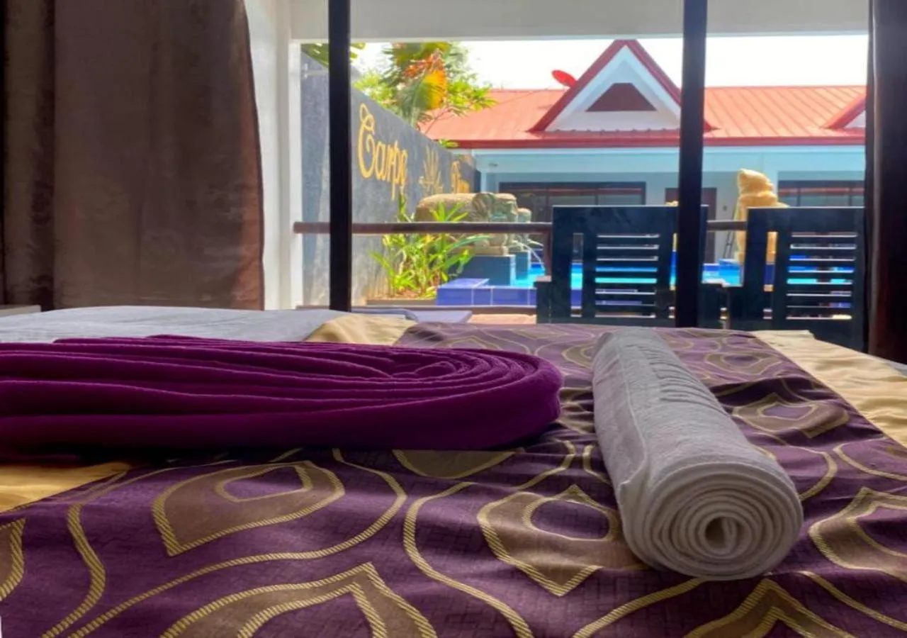 Bed in Carpe Diem Villas & Resort