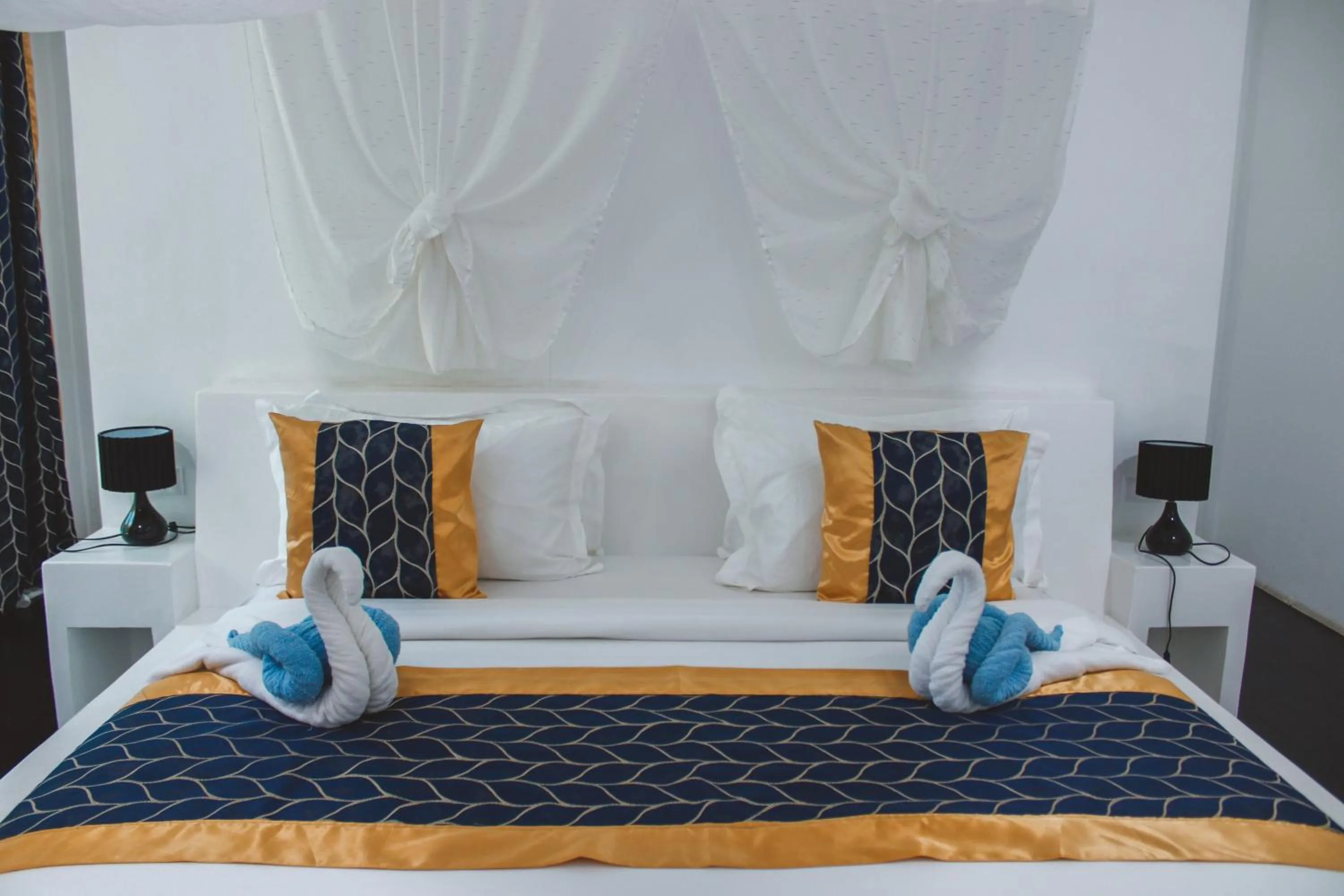 Bed in Carpe Diem Villas & Resort