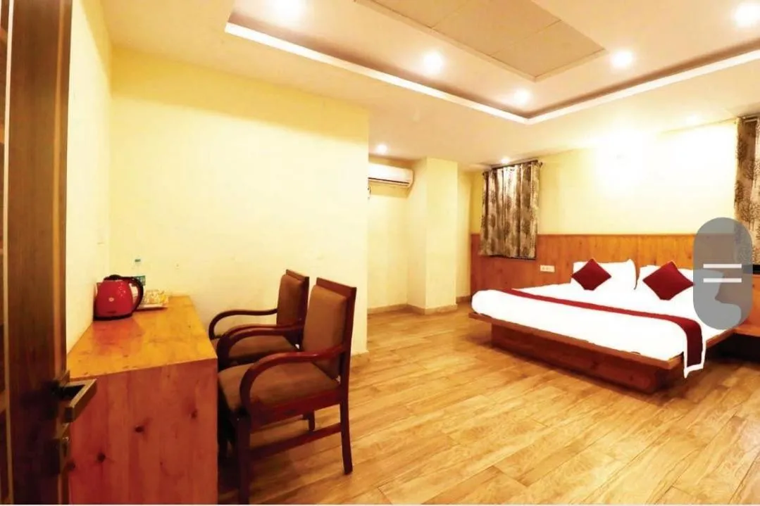 Bed in Hotel Royal Orbit