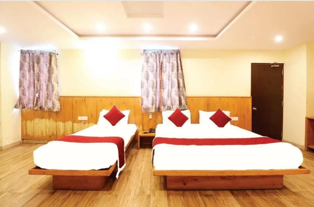 Bed in Hotel Royal Orbit