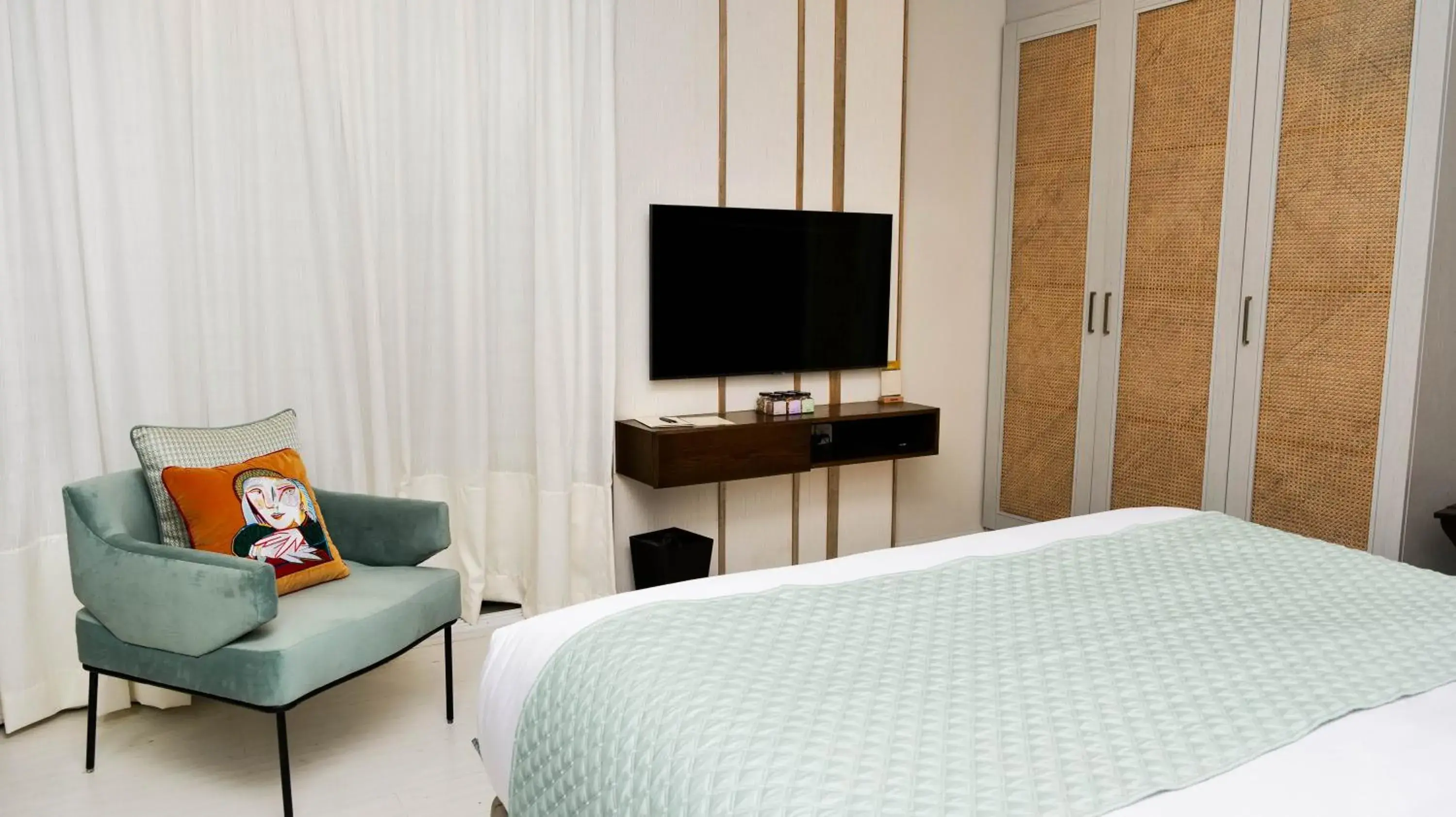 TV and multimedia, Bed in Ambiance Boutique Art Hotel Karachi TV and multimedia, Bed in Ambiance Boutique Art Hotel Karachi