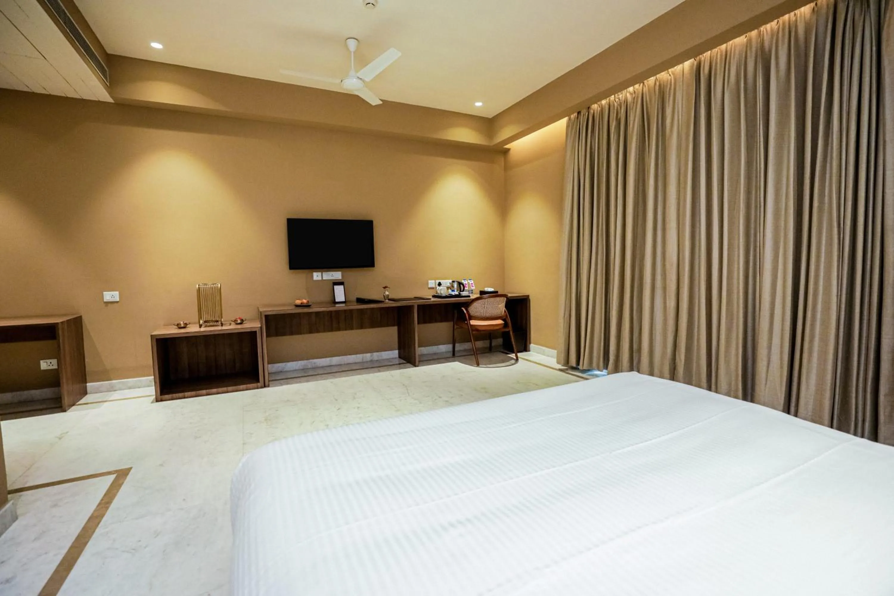 Photo of the whole room, Bed in Gulab Kothi by Royal Orchid Hotels Limited Varanasi