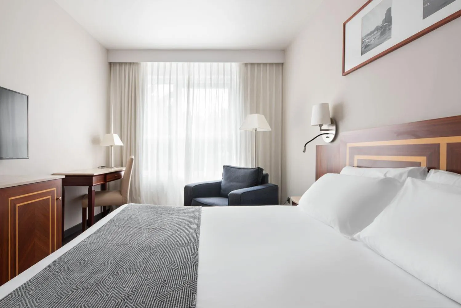 Photo of the whole room, Bed in Eurostars Ciudad de La Coruña