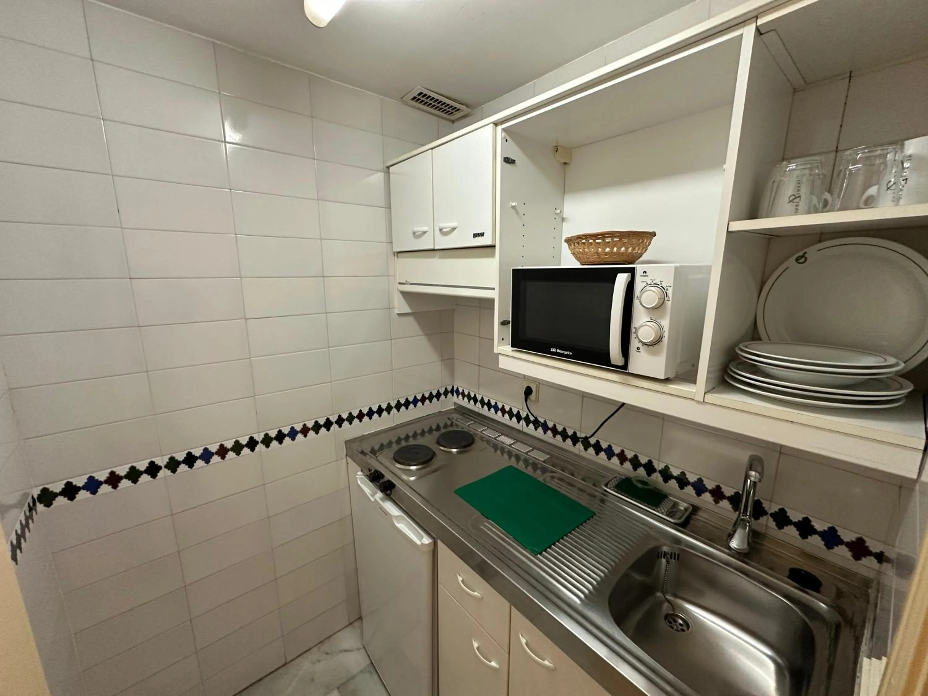 Kitchen or kitchenette in Hospedium Hotel Apartamentos Simón Verde