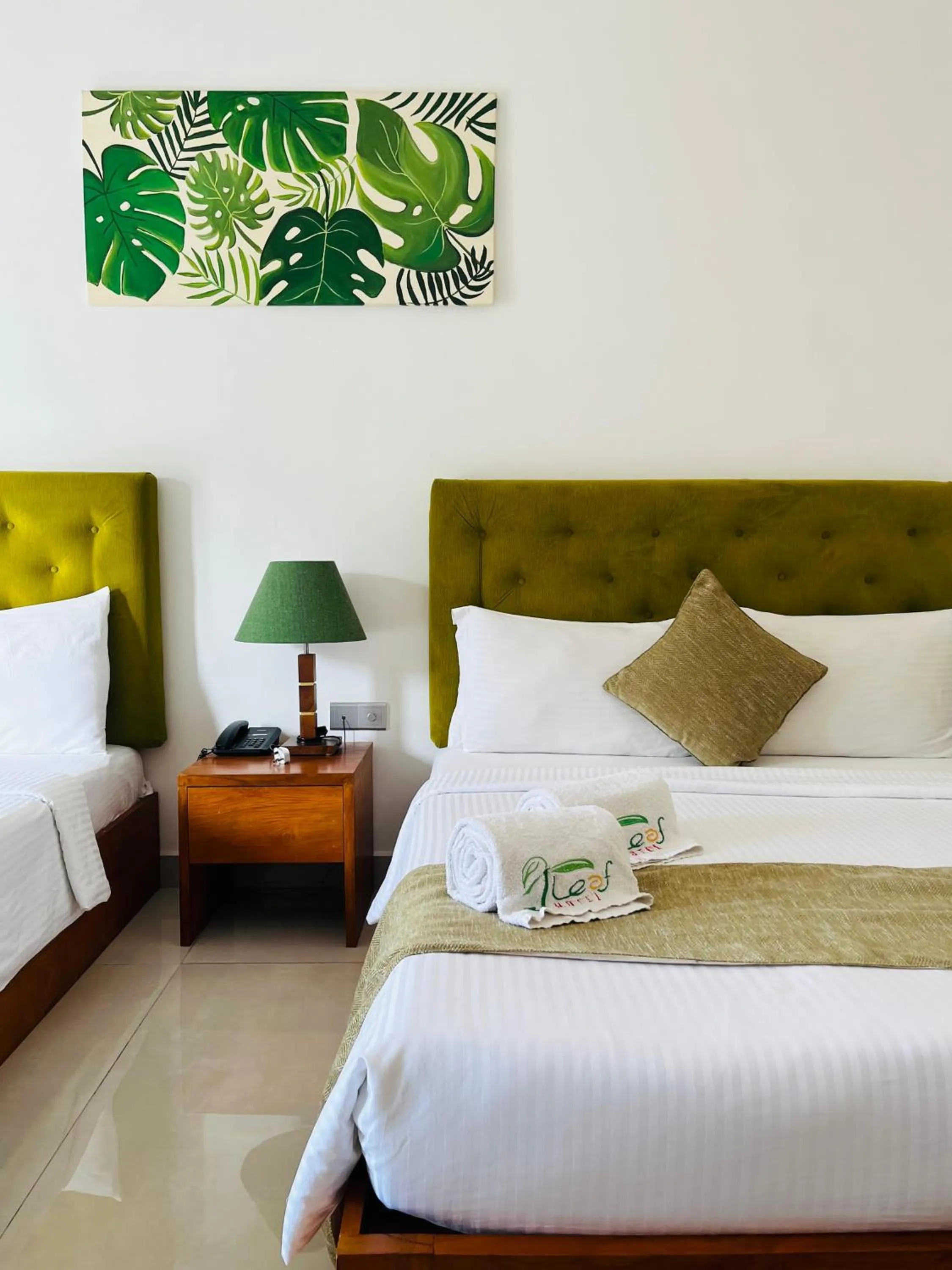 Bed in J leaf Hotel by Blue Bird