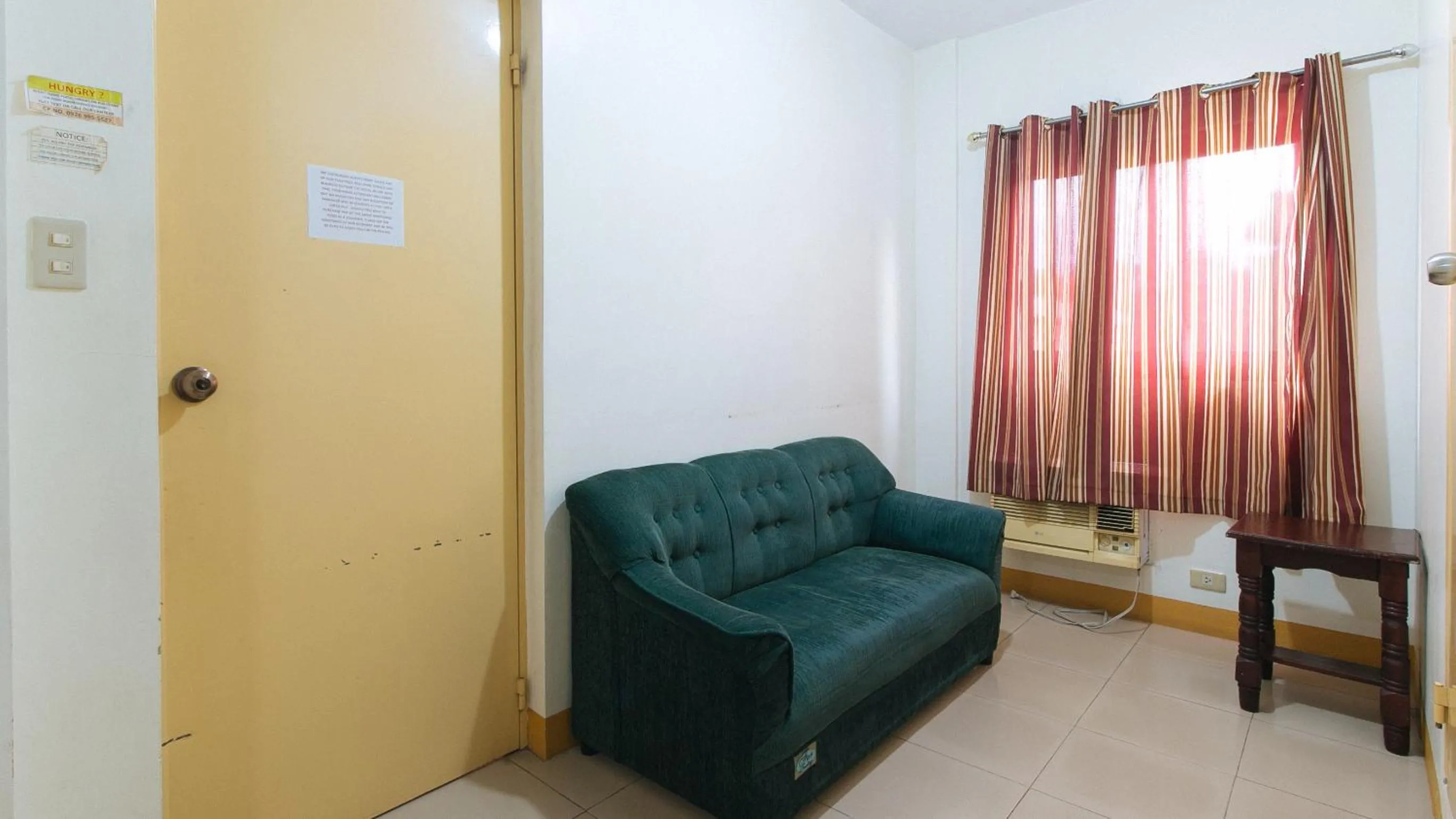 Seating area in Golden Sunrise Hotel II by RedDoorz